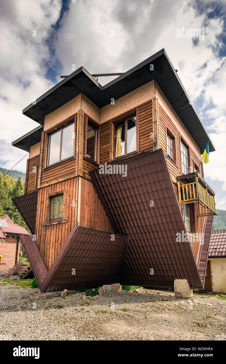 Upside Down House in Bukovel Ukraine. It stands on its roof and visitors walk on the ceilings. Stock Photo