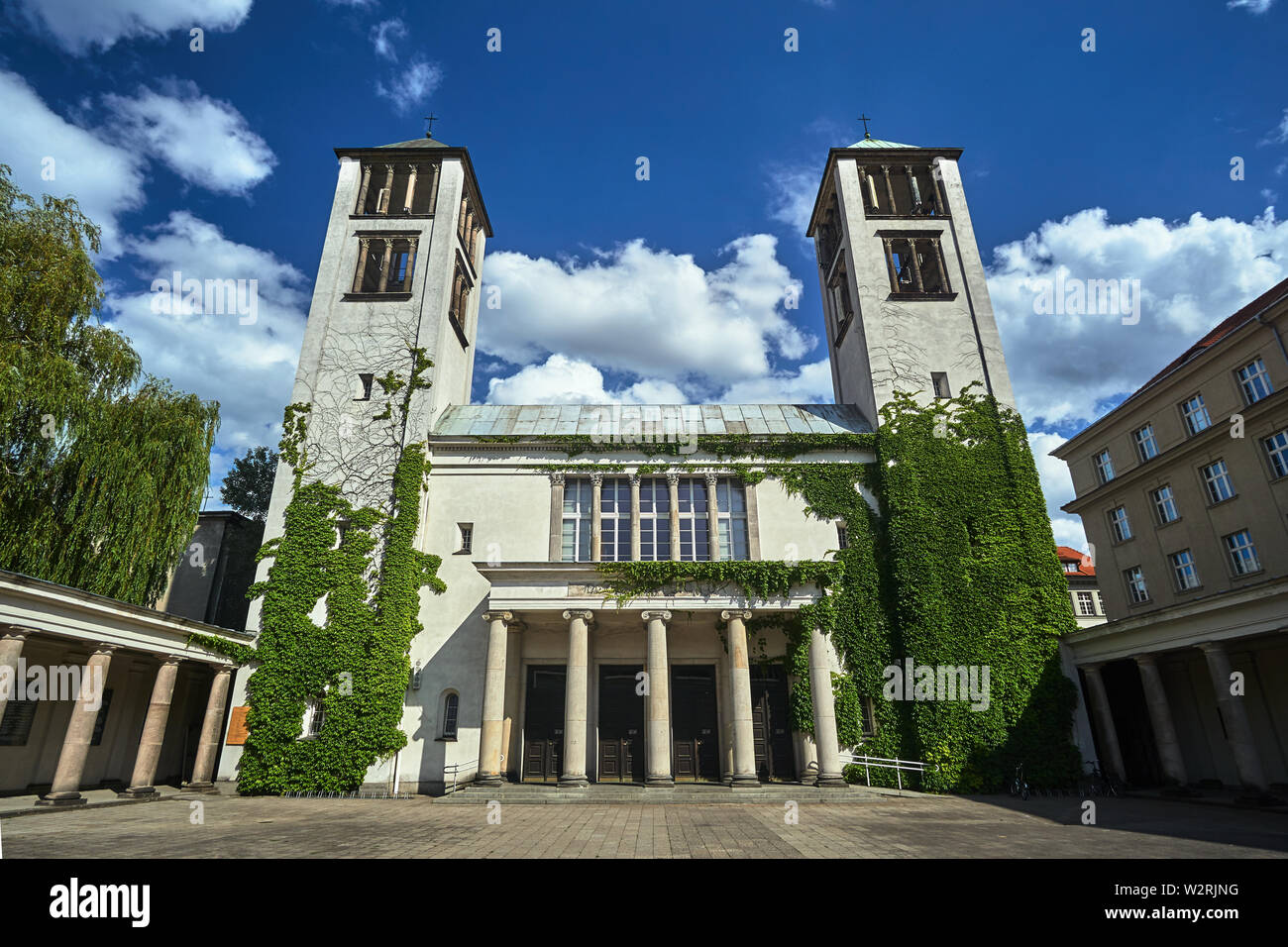 Eclectic facade of the Catholic temple with two towers in Poznan Stock Photo