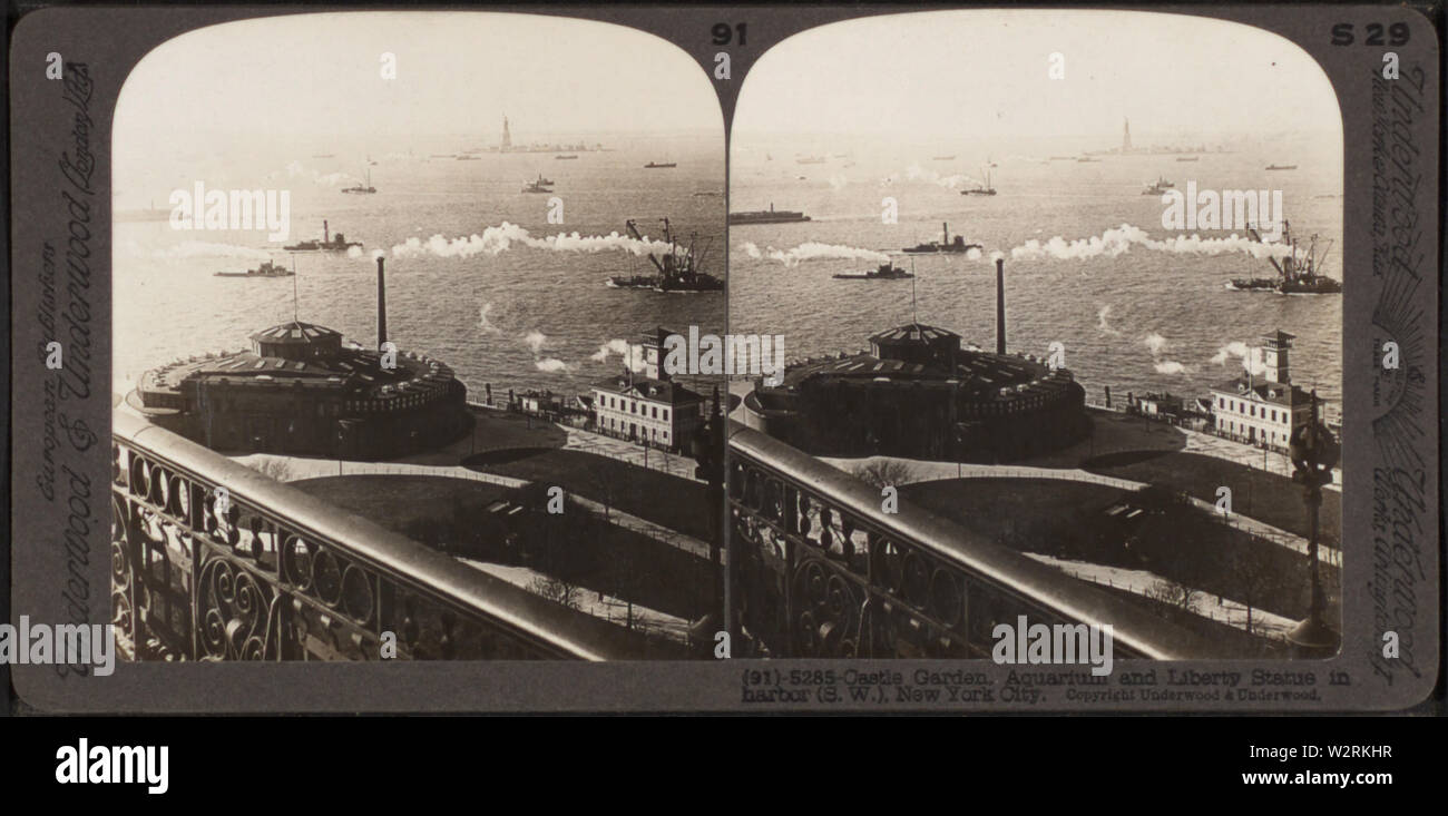 Castle Garden, the Aquarium and Liberty Statue in harbor(SW) New York City, by Underwood