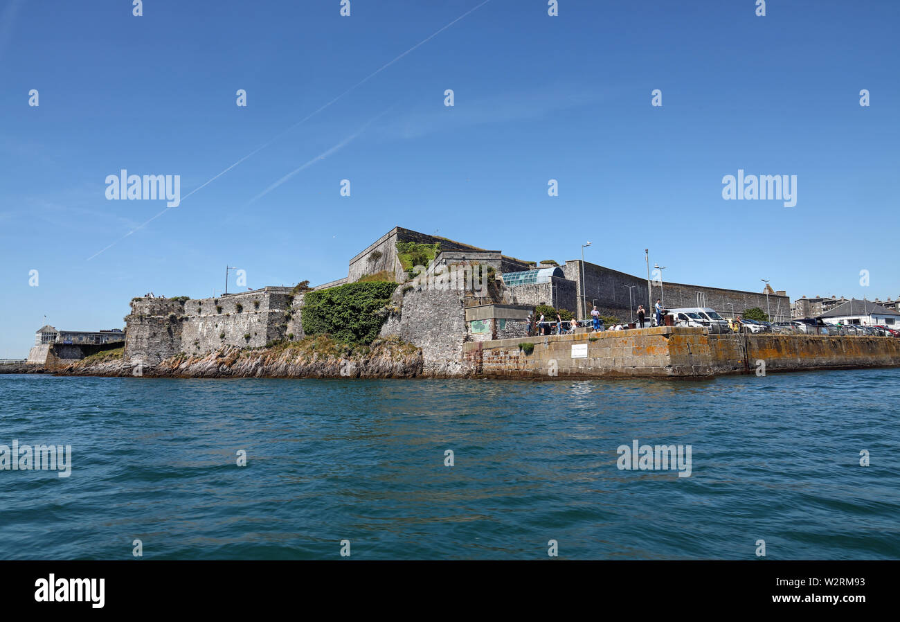 Royal Citadel, home to the Royal Marines. Historic fortess built on Plymouth Hoe overlooking the historic Barbican. Anglers to the fore with their fis Stock Photo
