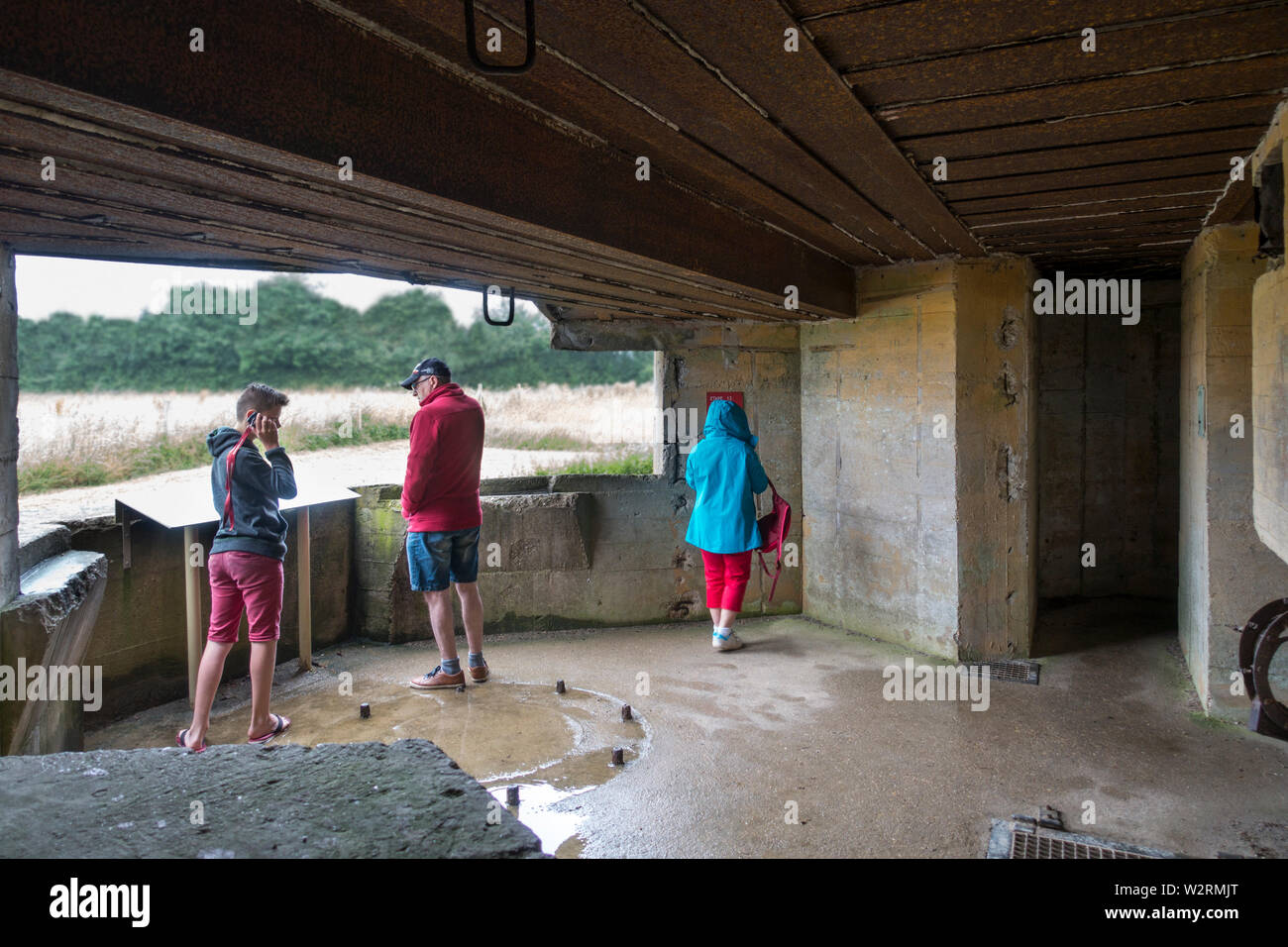 Tourists visiting WWII Batterie d'Azeville / Azeville Battery, part of the German Atlantic Wall built by Organisation Todt, Normandy, France Stock Photo