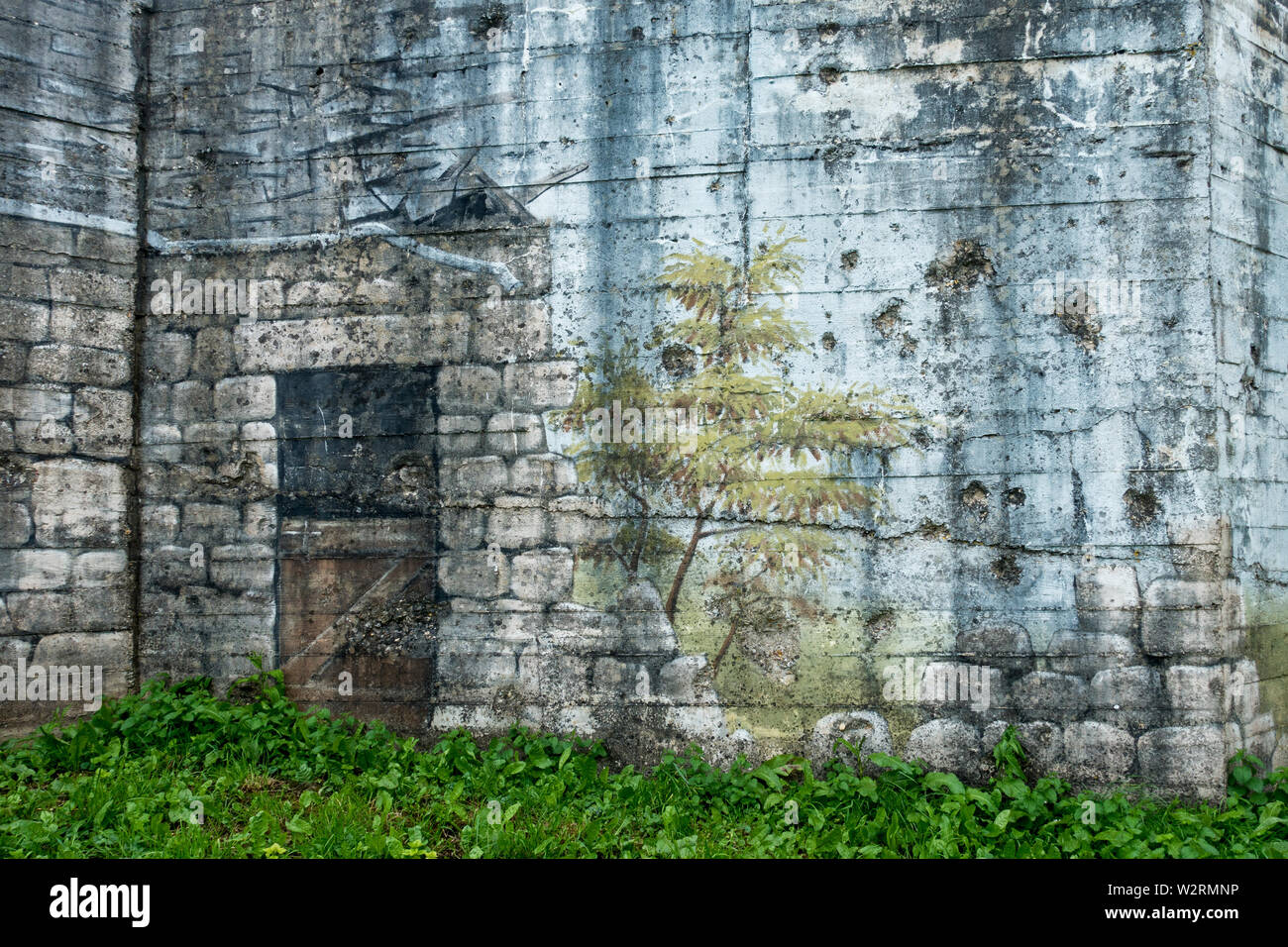 Camouflage painting on rear of gun casemate / artillery bunker of WWII Batterie d'Azeville Battery, part of German Atlantic Wall, Normandy, France Stock Photo