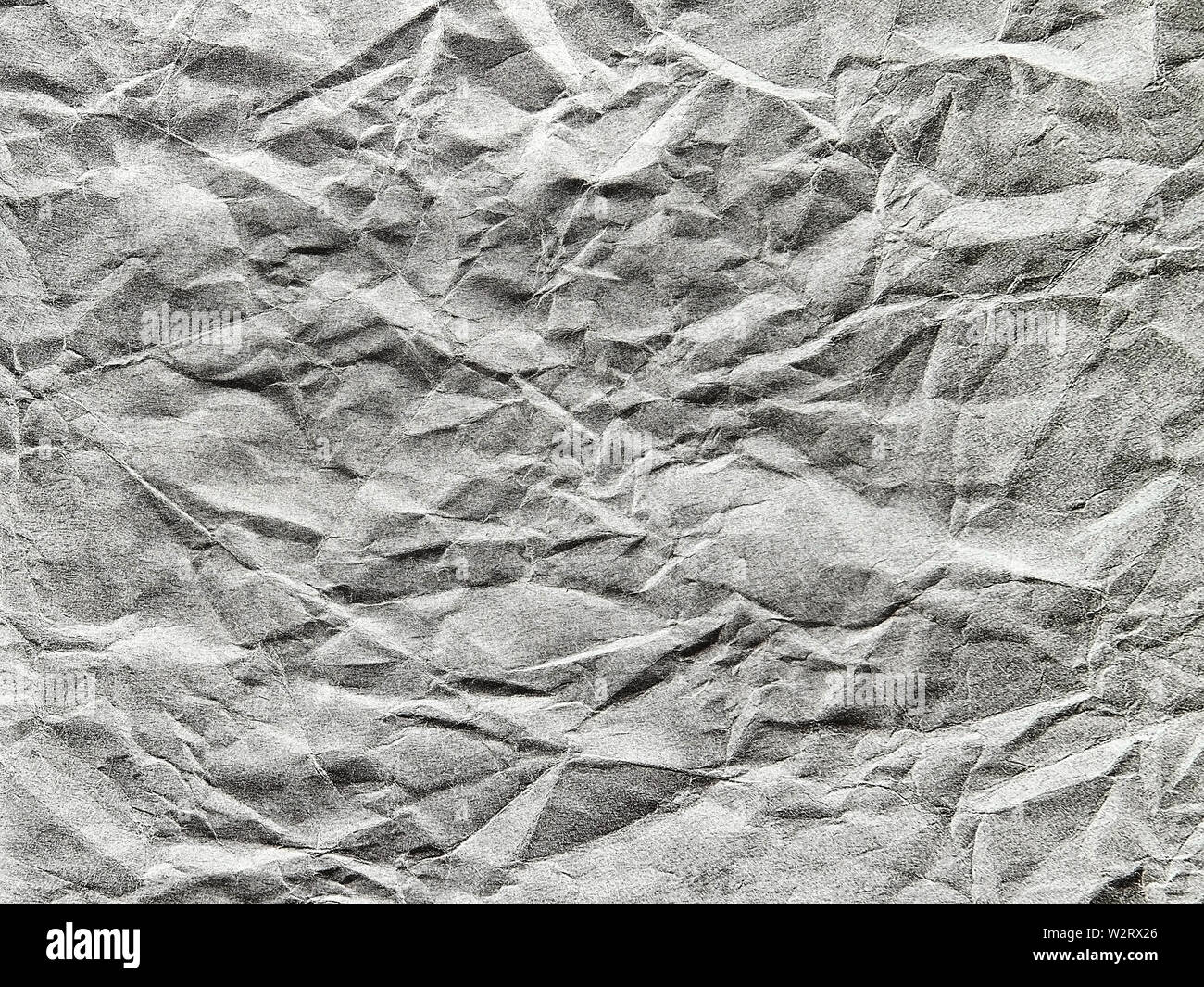 Black crumpled paper as a background Stock Photo - Alamy