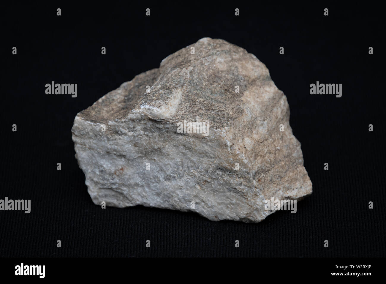 Piece of hard ground rock of Manhattan granite ground rock Stock Photo ...