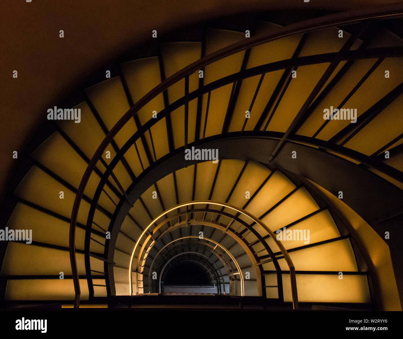 Spiral stairway from above at night Stock Photo