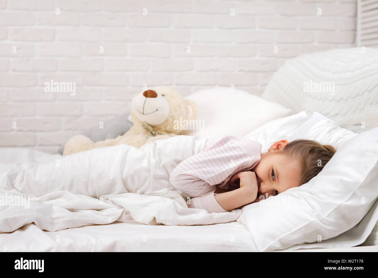 smiling little child girl sleeping in her bed Stock Photo - Alamy