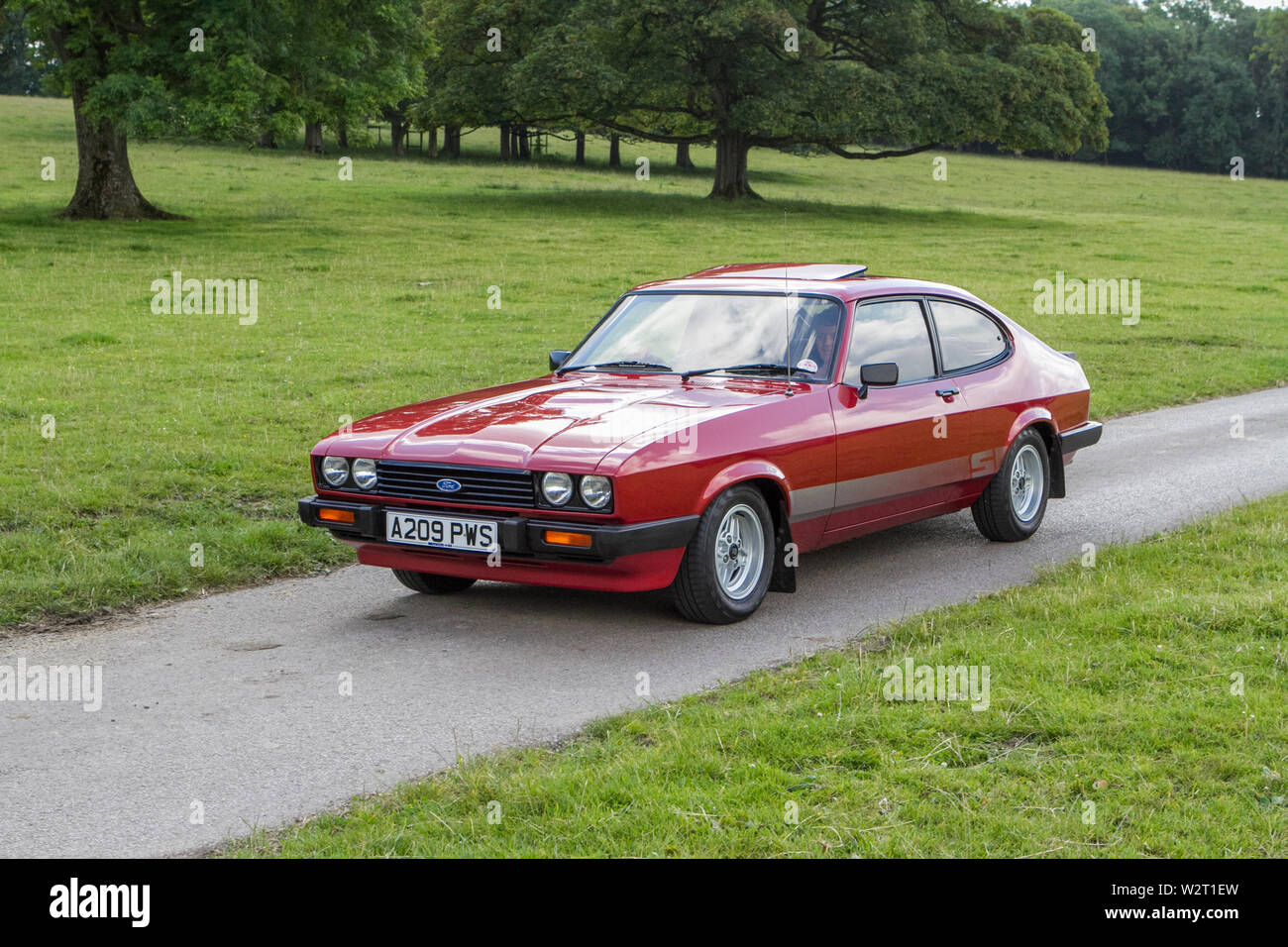 Vintage classic restored historic vehicles cars arriving at the