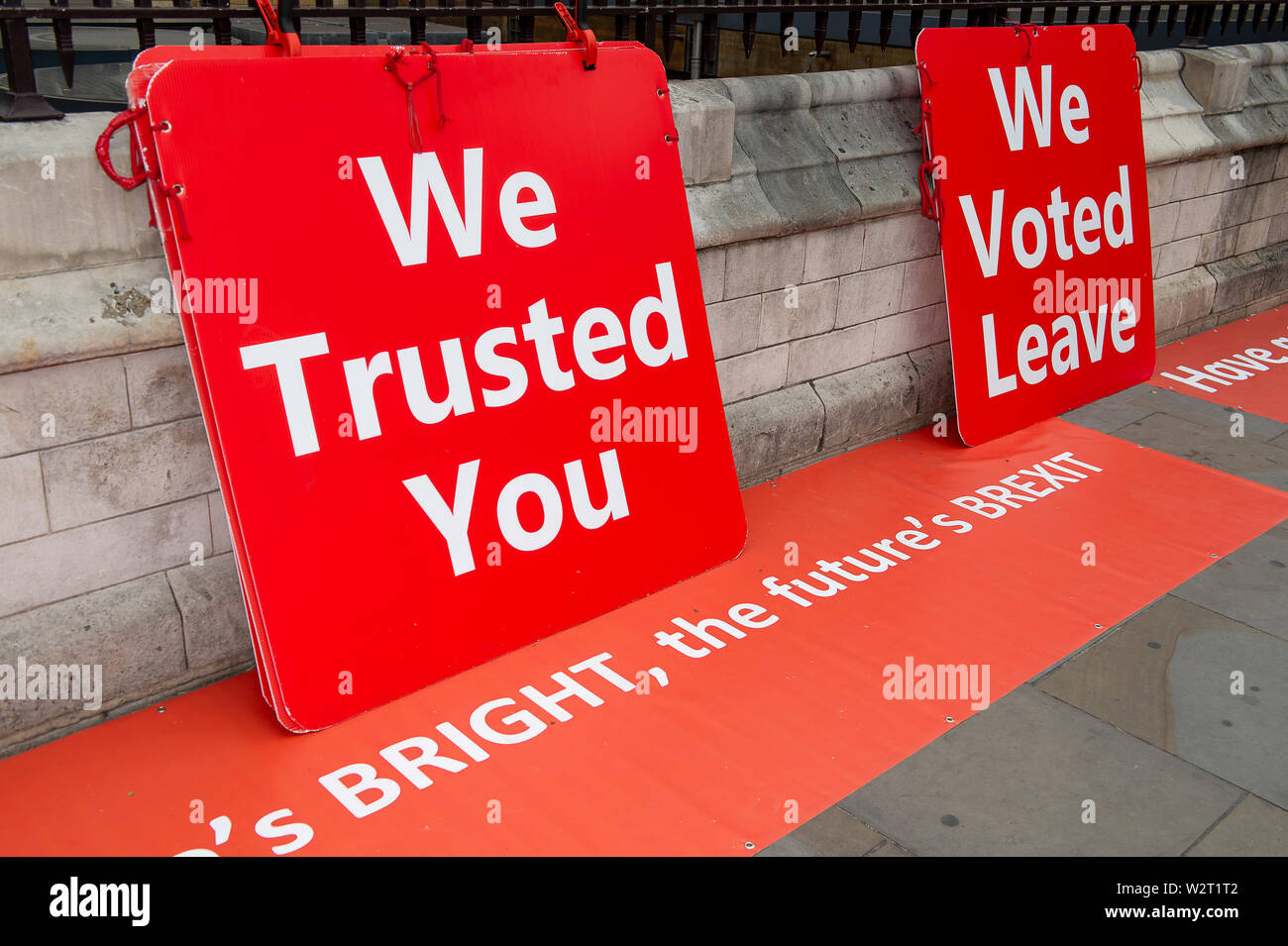 Pro Brexit Campaign, Westminister, London. 9th July, 2019. Pro Brexit red campaign signs leaning against the walls of the Palace of Westminister. Credit: Maureen McLean/Alamy Stock Photo