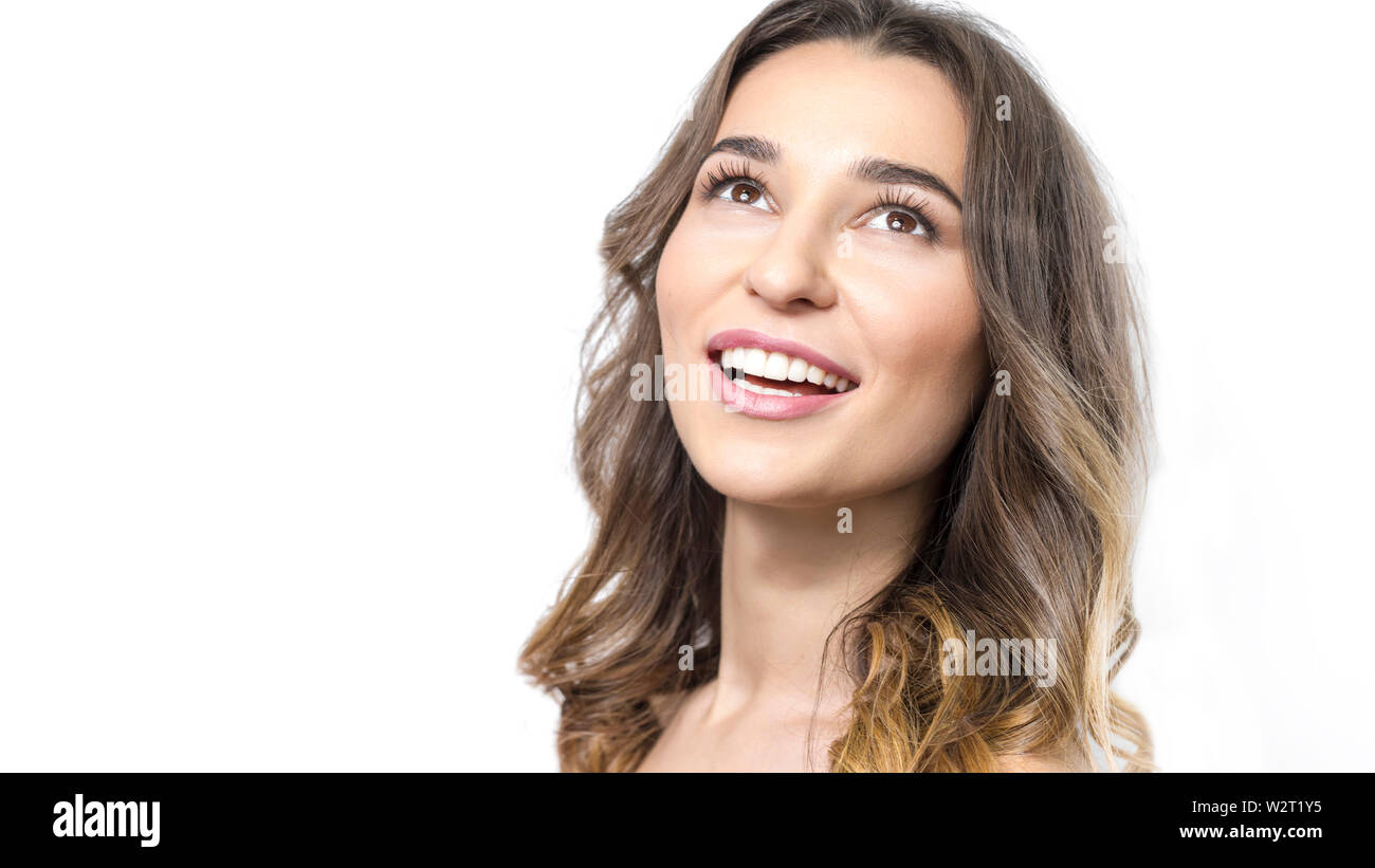 Beautiful young woman smiling, white healthy teeth, clean skin. Stock Photo