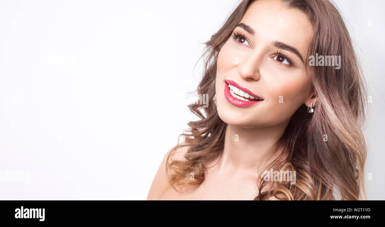 Beautiful young woman smiling, white healthy teeth, clean skin. Stock Photo