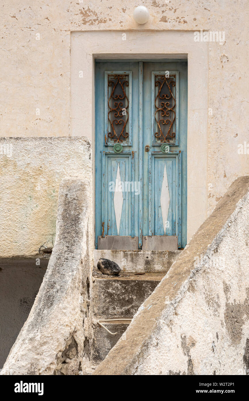 Door and stairs with peeling paint in Akrotiri, Santorini Stock Photo