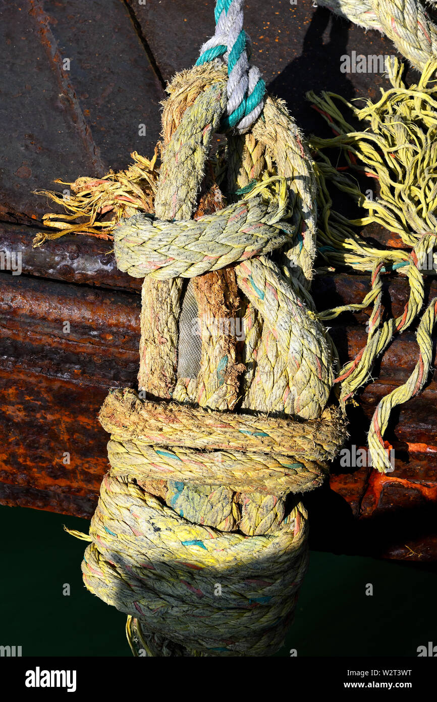 port of rotterdam, netherlands - march 31, 2018:  knot tied ropes at a barge moored at prinses margriethaven masvlakte 2 Stock Photo