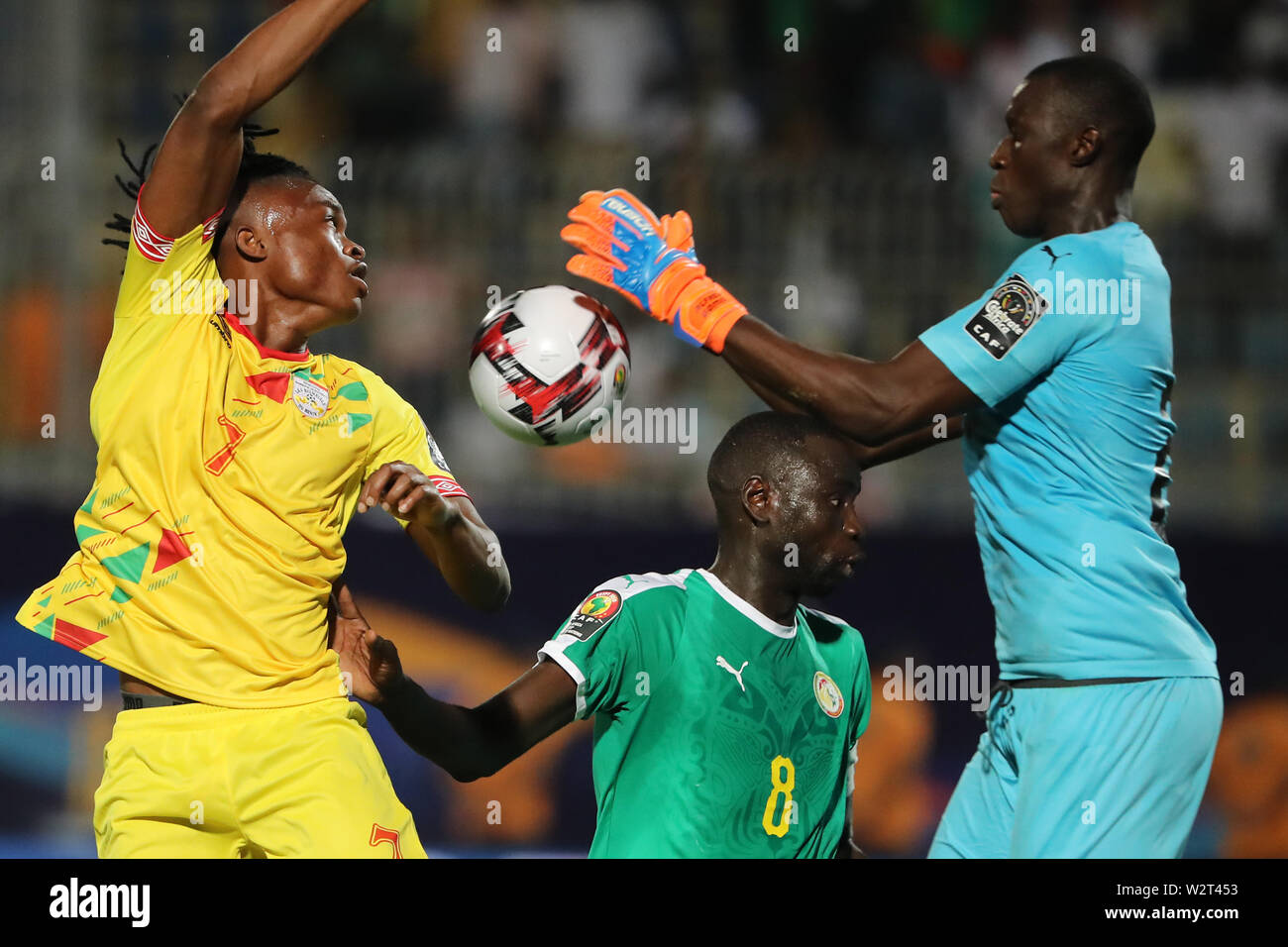 Cairo, Egypt. 10th July, 2019. Benin's David Djigla (L) in action against Senegal goalkeeper Alfred Gomis (R) during the 2019 Africa Cup of Nations quarter final soccer match between Senegal and Benin at the 30 June stadium. Credit: Omar Zoheiry/dpa/Alamy Live News Stock Photo