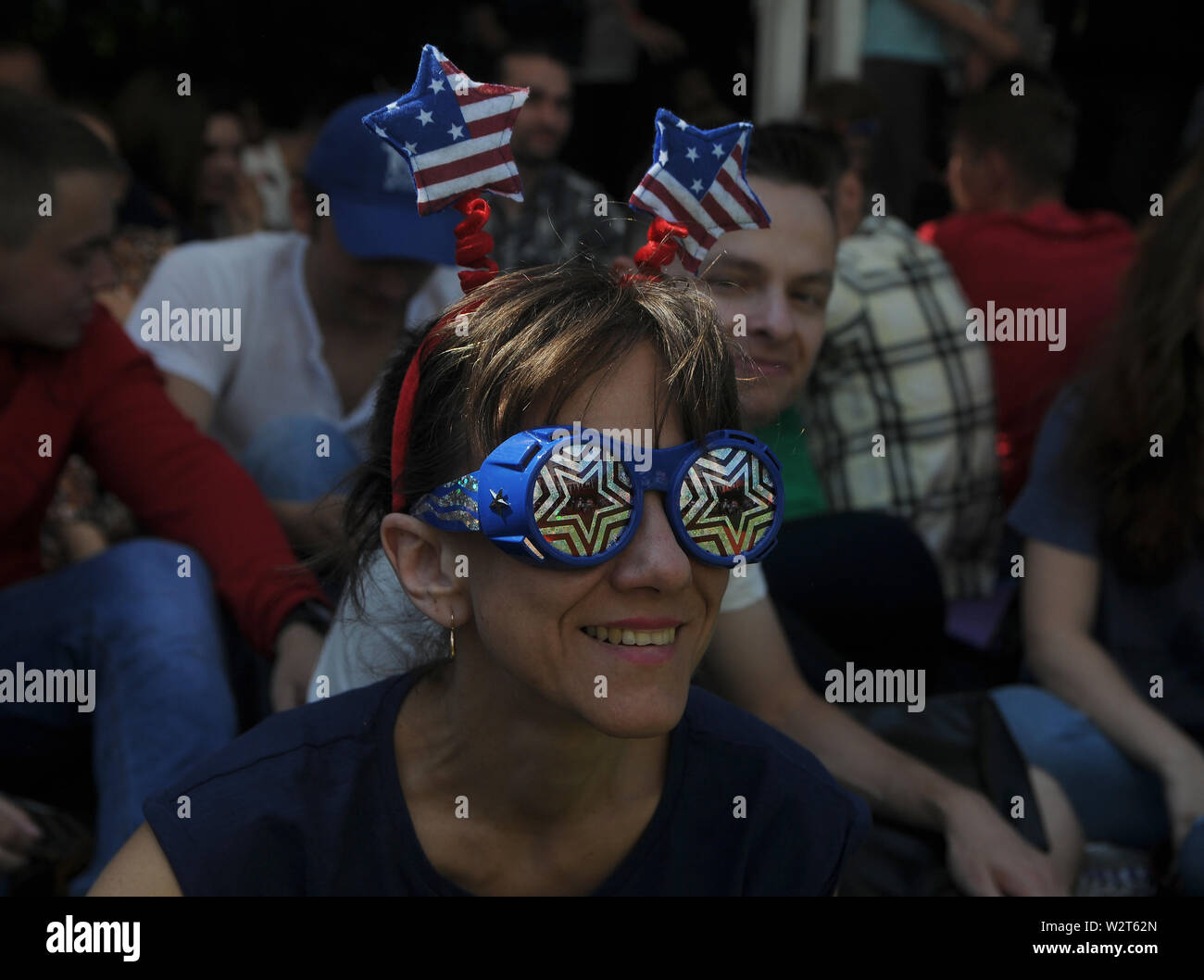 Kiev, Ukraine. 7th July, 2019. A woman with stars of the American flag and star glasses during the US Independence Day celebration at the American House. Credit: Alexey Ivanov/SOPA Images/ZUMA Wire/Alamy Live News Stock Photo
