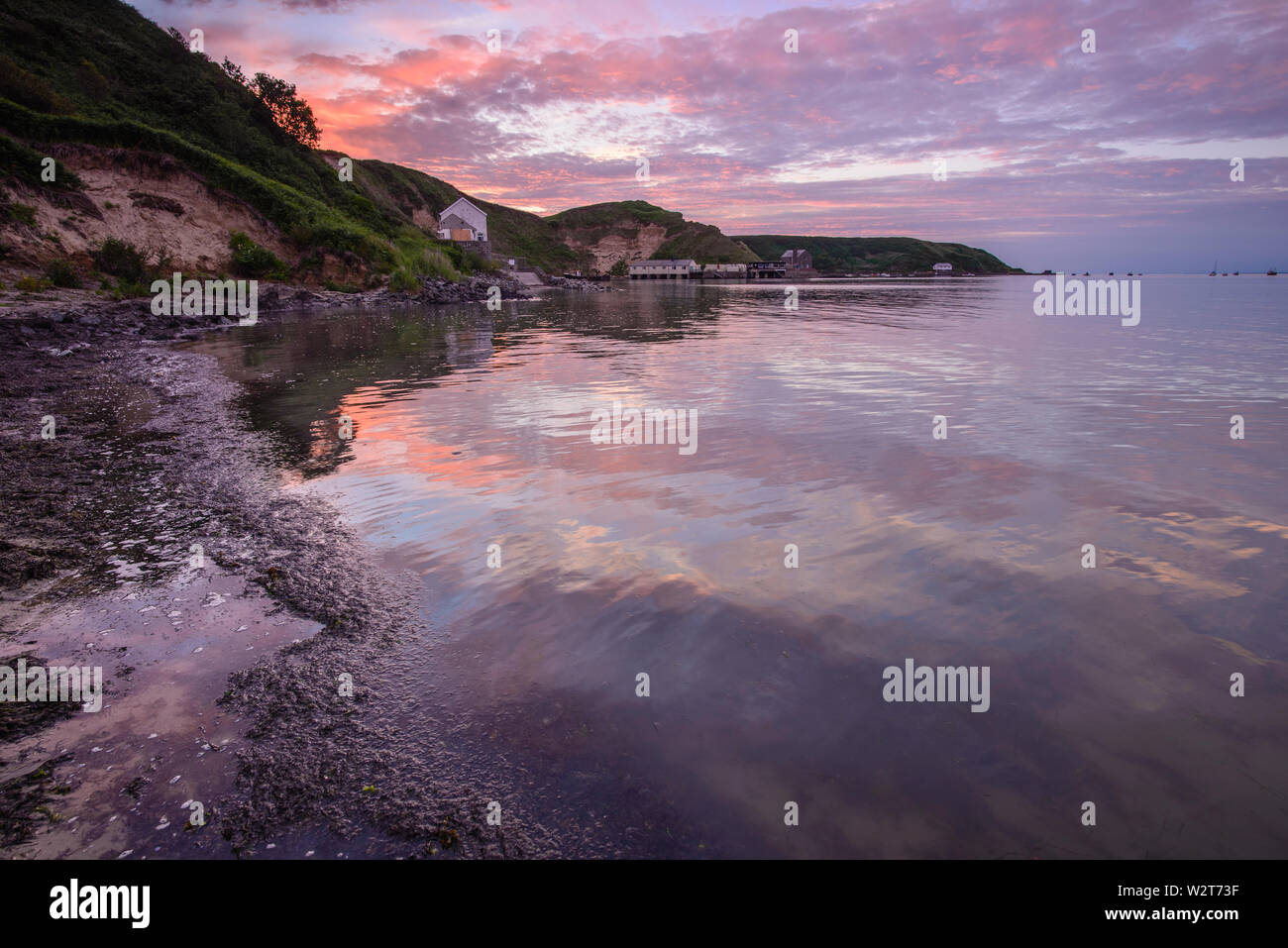 Colours of sunset refected in sea Stock Photo - Alamy