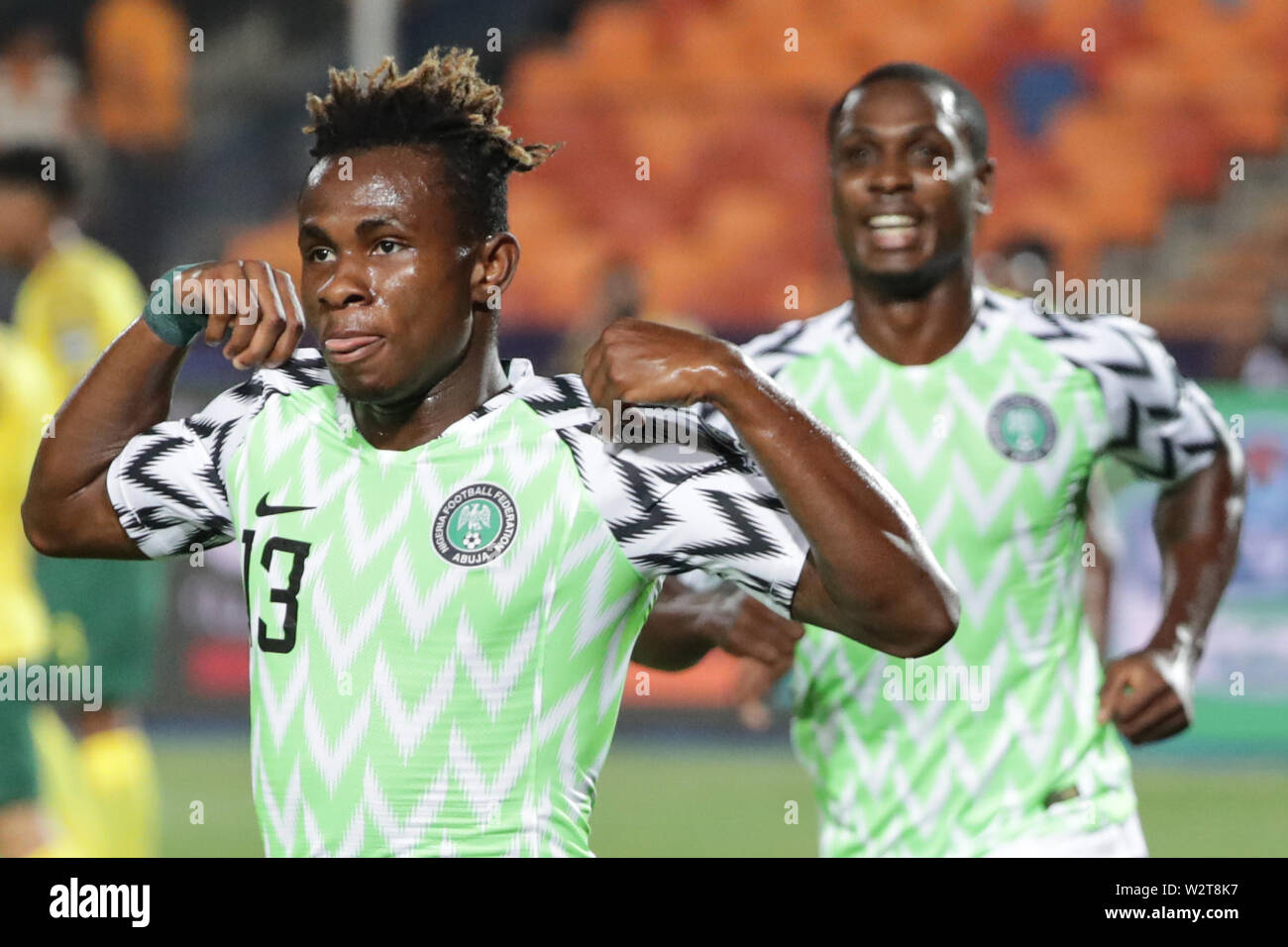 Cairo, Egypt. 10th July, 2019. Nigeria's Samuel Chukwueze (L) celebrates scoring his side's first goal during the 2019 Africa Cup of Nations quarter final soccer match between Nigeria and South Africa at the Cairo International Stadium. Credit: Oliver Weiken/dpa/Alamy Live News Stock Photo