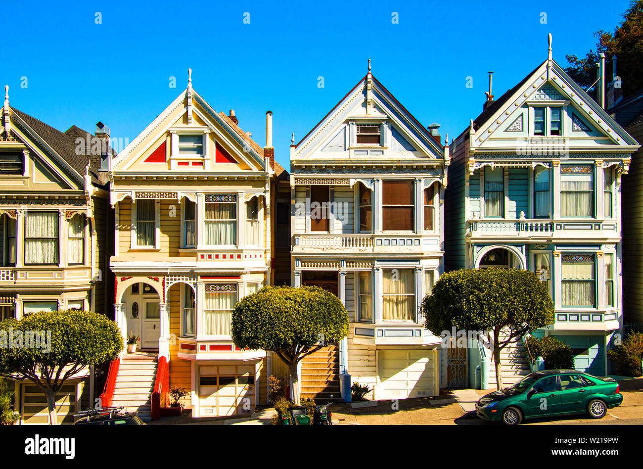 San Francisco residential street with The Painted Ladies, rows of victorian wooden houses at Alamo Square. San Francisco, California, USA Stock Photo