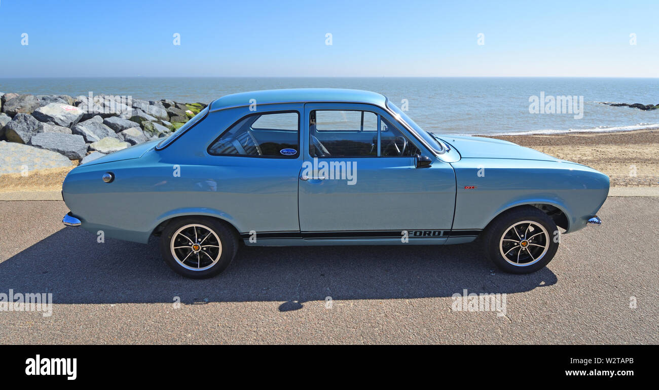 Classic Silver Ford Escort Motor Car Parked on Seafront Promenade. Stock Photo