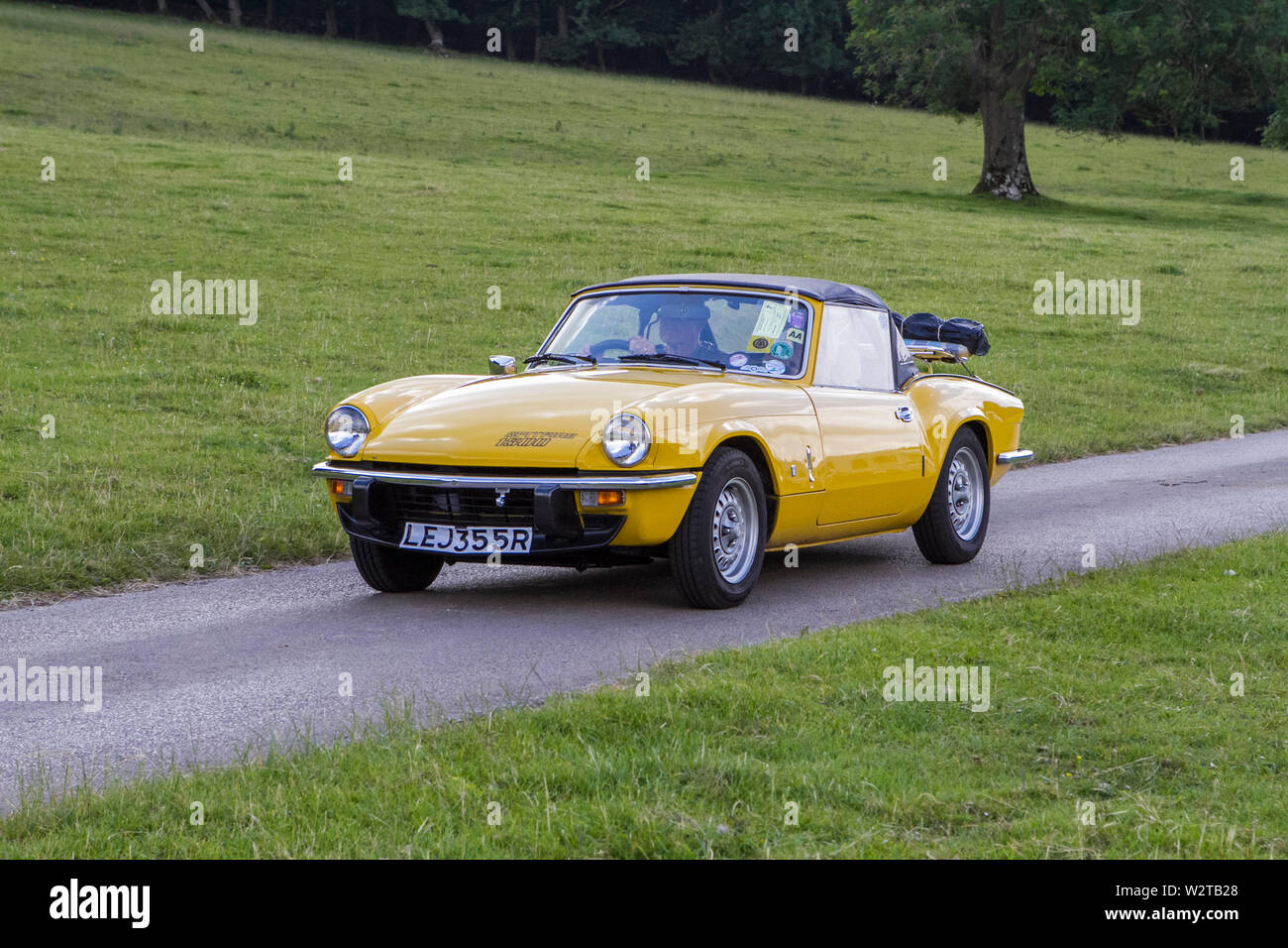 Vintage classic restored historic vehicles cars arriving at the