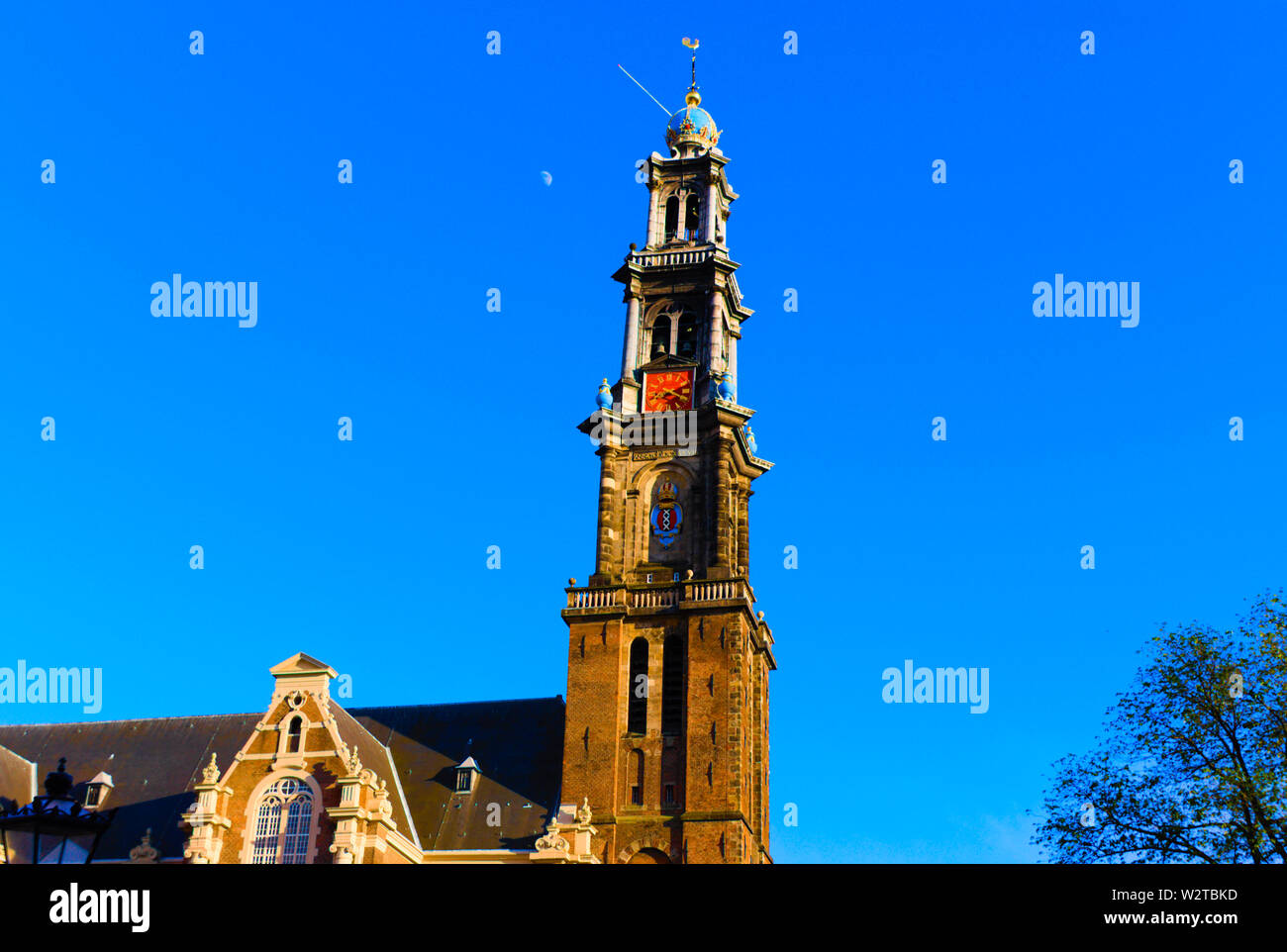 wester church amsterdam daytime with the moon in the background Stock Photo