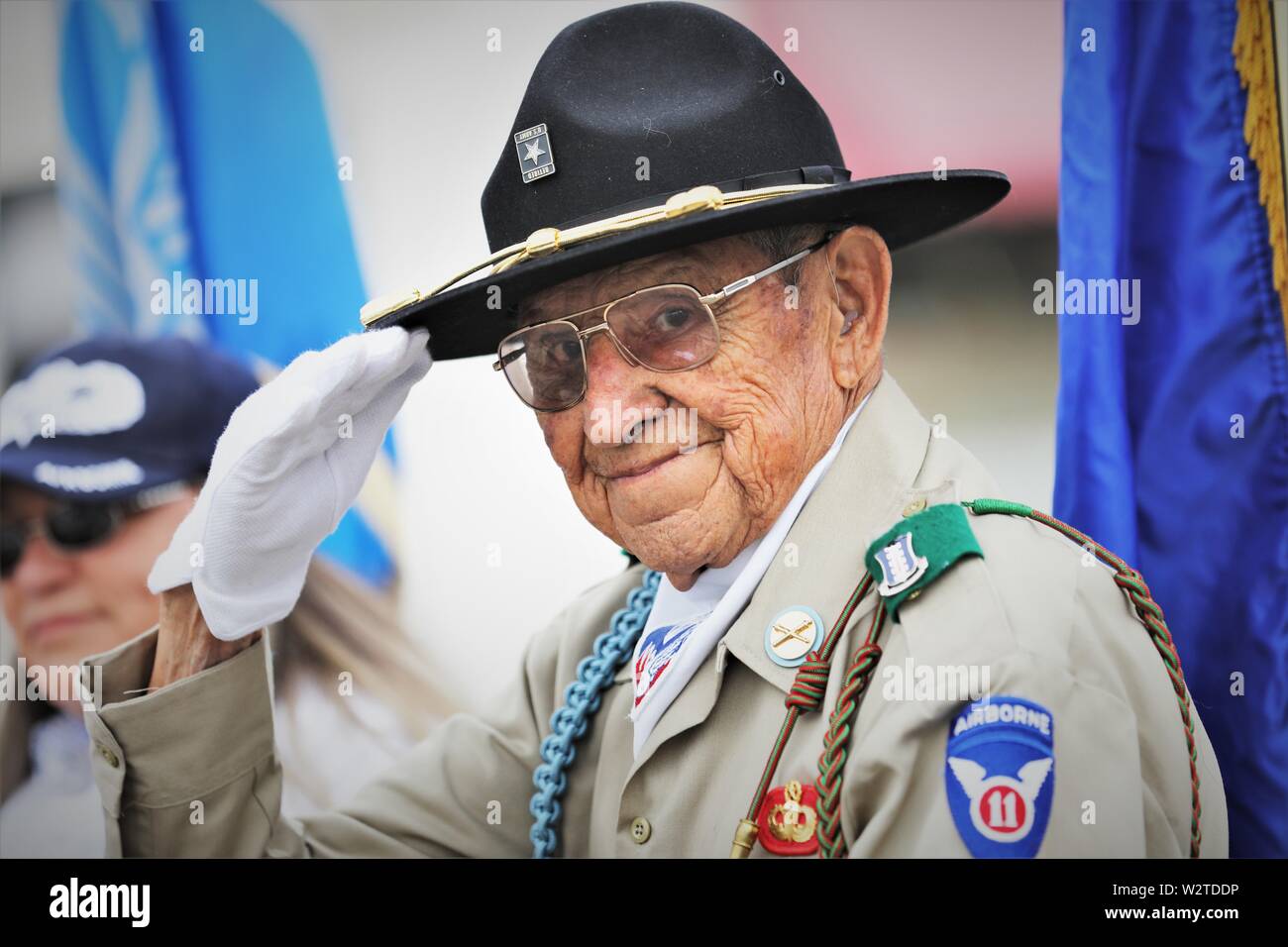 World War 2 II real veteran in parade being proud of his past military service in fighting for American values in USA Family 92 Yr old Army vet Stock Photo