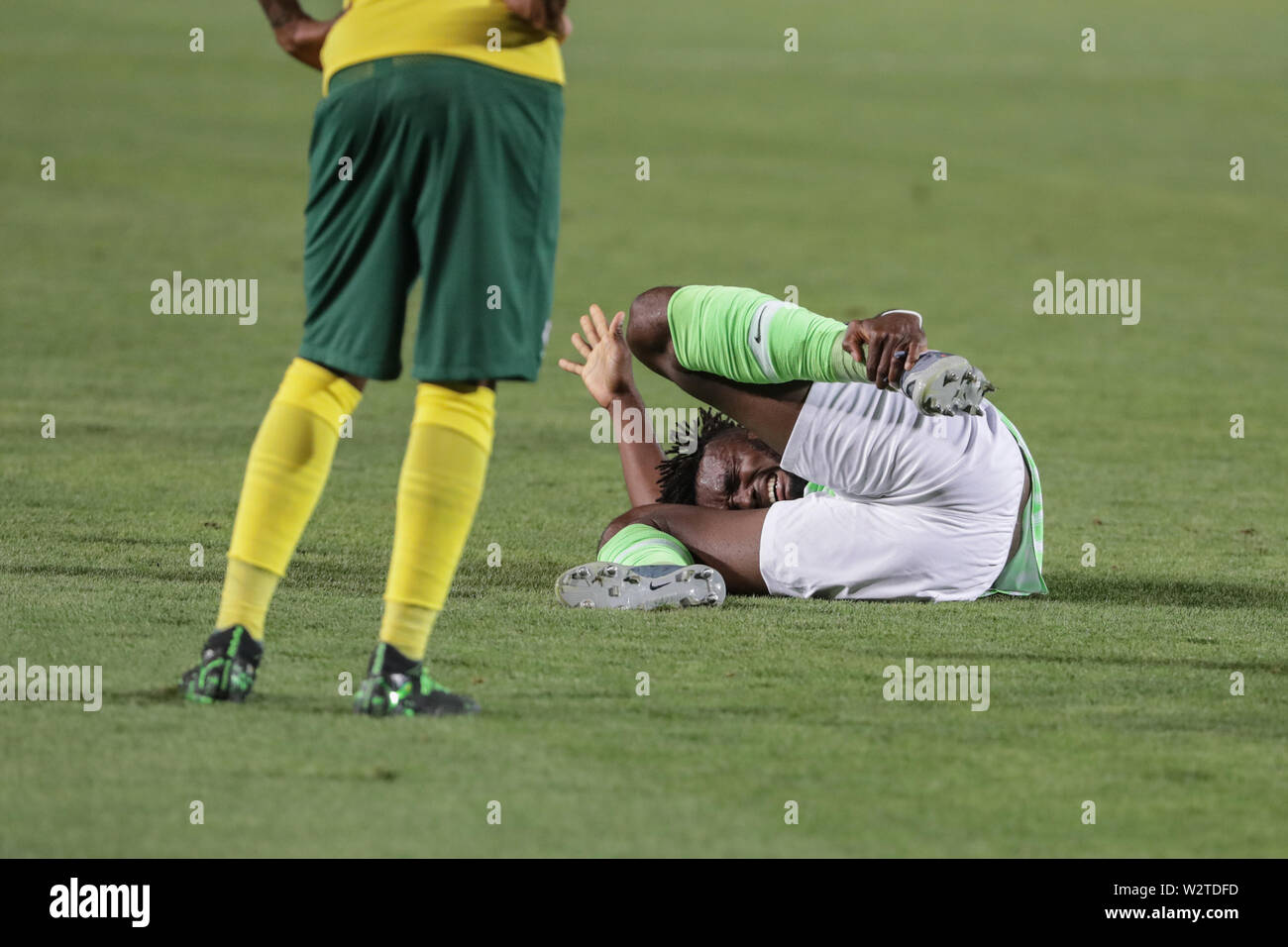 Cairo, Egypt. 10th July, 2019. Nigeria's Chidozie Awaziem reacts to an injury during the 2019 Africa Cup of Nations quarter final soccer match between Nigeria and South Africa at the Cairo International Stadium. Credit: Oliver Weiken/dpa/Alamy Live News Stock Photo