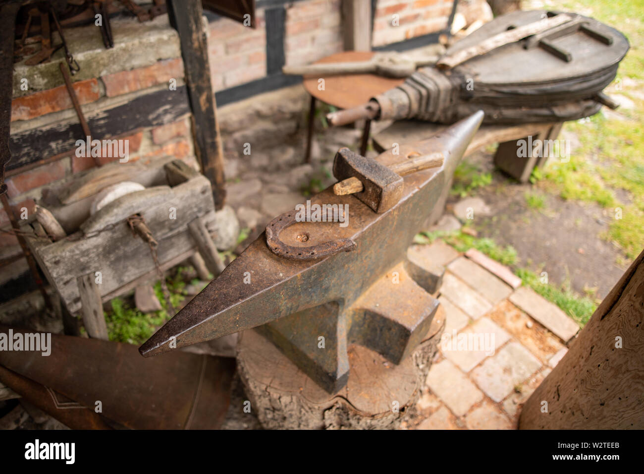 Tools in an old blacksmith's Horseshoe and hammer on a large
