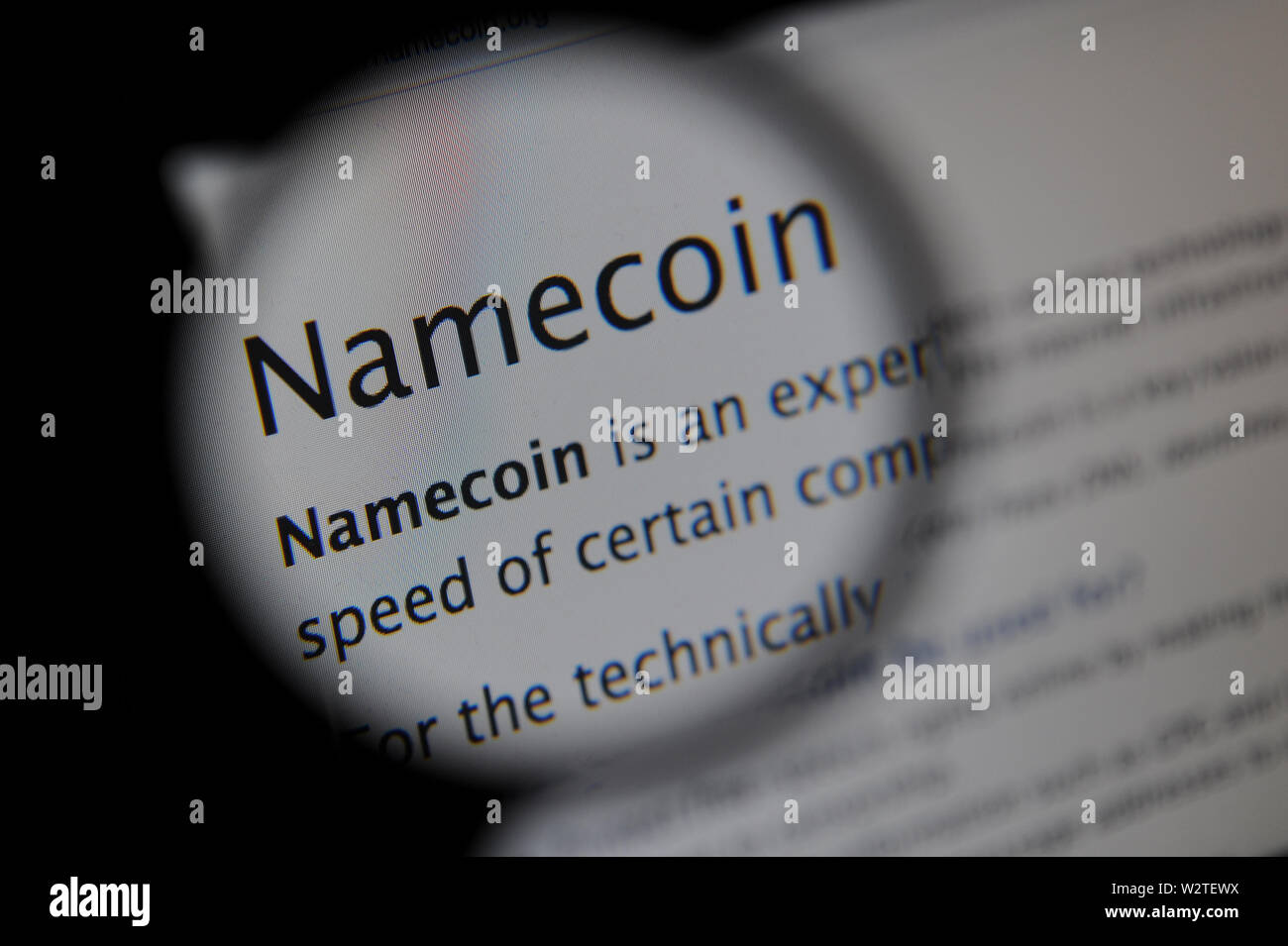 The Namecoin website seen through a magnifying glass Stock Photo