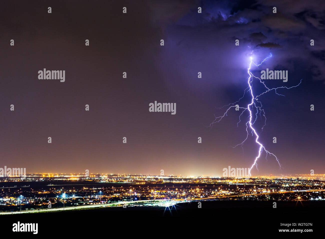 A dramatic lightning bolt strike as a storm moves across El Paso, Texas Stock Photo