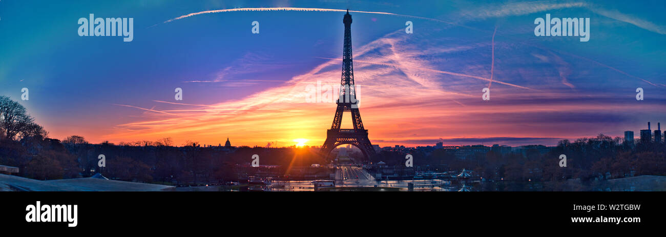 Amazing Eiffel Tower Panorama on a very Early Morning in Paris. This is a very rare sky over Paris, hence it makes this picture a very special one. Stock Photo