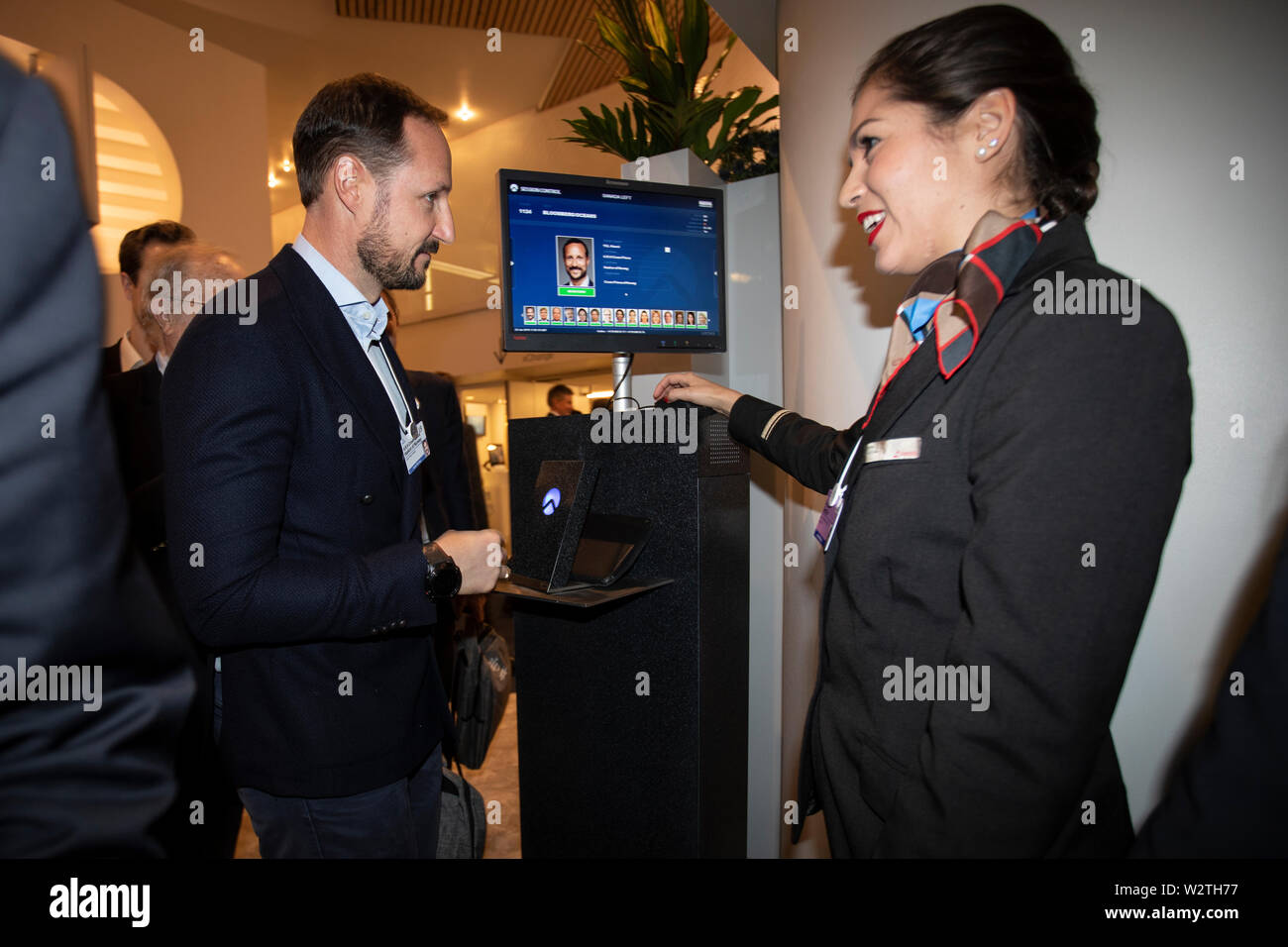 During the World Economic Forum, His Royal Highness Crown Prince Haakon of Norway has his ID card checked before entering a lecture by Nina Jensen and Al Gore on climate and oceans. Stock Photo