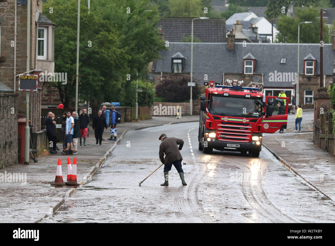 Dingwall, UK. 10th July, 2019. Flash flooding struck several streets in Dingwall, causing road closures and damage to property. Pictured is the clean-up operation on Burn Place. Credit: Andrew Smith/Alamy Live News Stock Photo