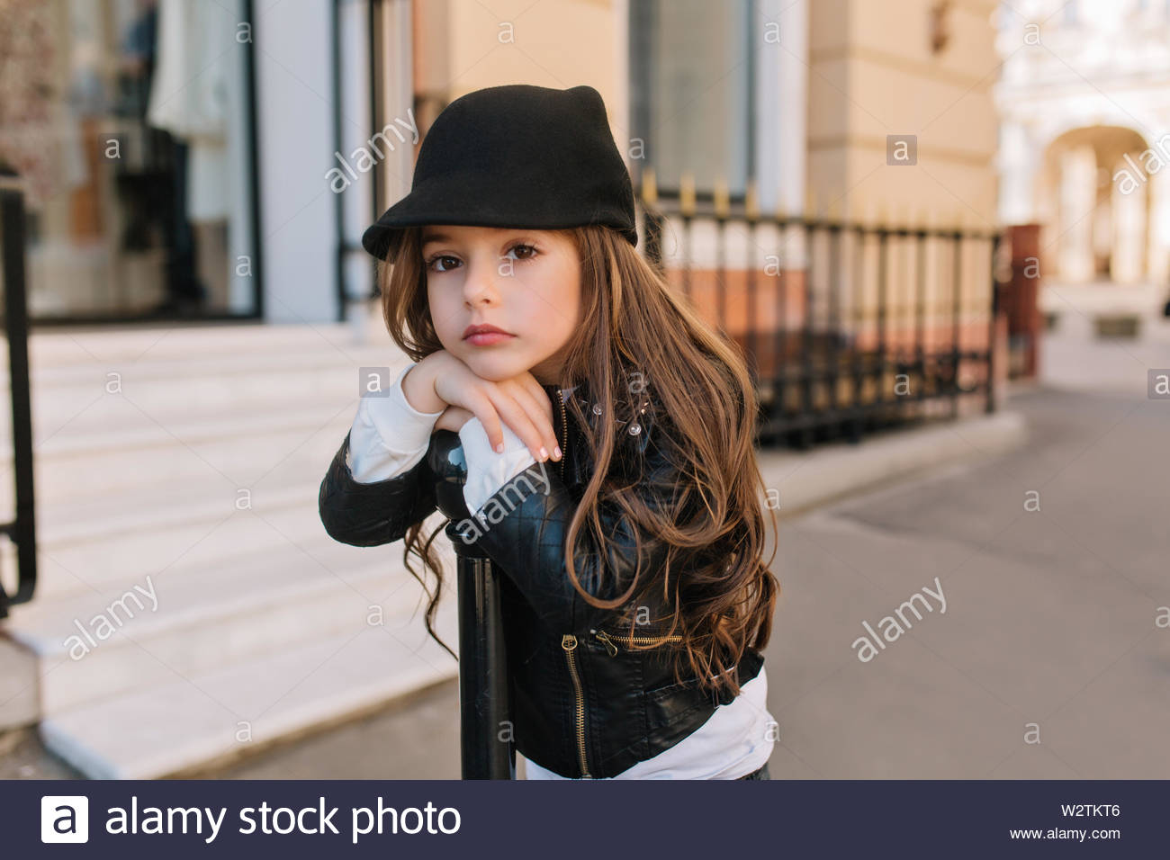 Boring Lovely Little Girl In Cute Black Hat Waiting For Mother
