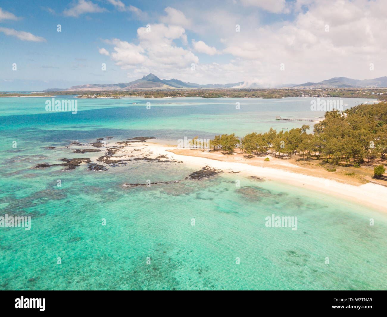 Aerial view of beautiful tropical beach with turquoise sea. Tropical vacation paradise destination of D'eau Douce and Ile aux Cerfs Mauritius Stock Photo