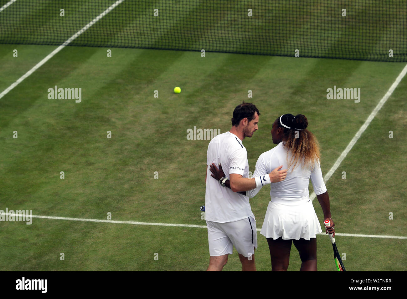 Wimbledon, UK. 10th July, 2019. Andy Murray and Serena Williams embrace
