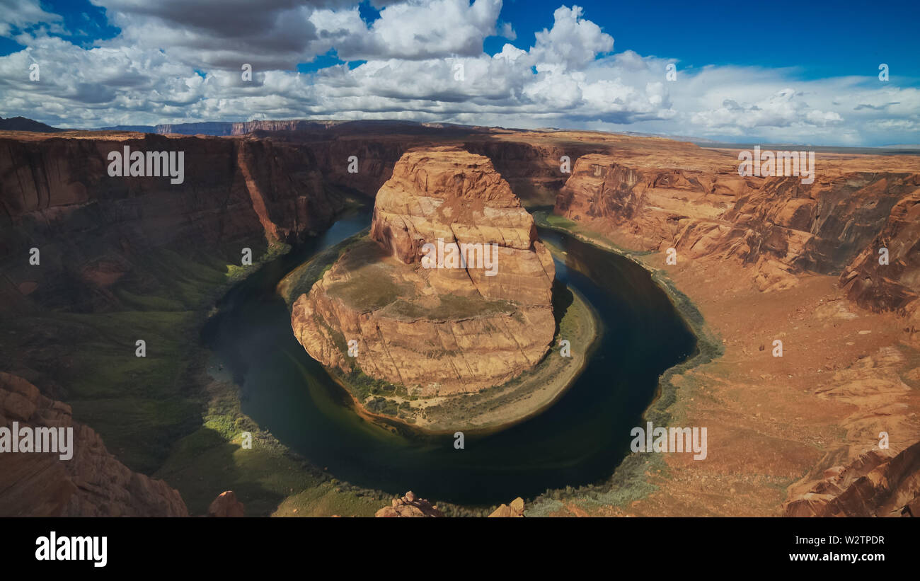 ultra wide shot of horseshoe bend with blue sky Stock Photo