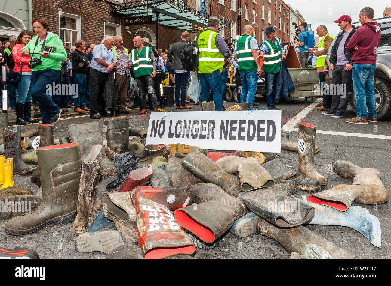 Dublin, Ireland. 10th July, 2019. Thousands of farmers descended on Leinster House today in protest at the Mercosur Deal which farmers claim will be the final nail in the coffin for their way of life. Farmers dumped their wellies outside the Dail claiming they're 'no longer needed'. Credit: Andy Gibson/Alamy Live News. Stock Photo