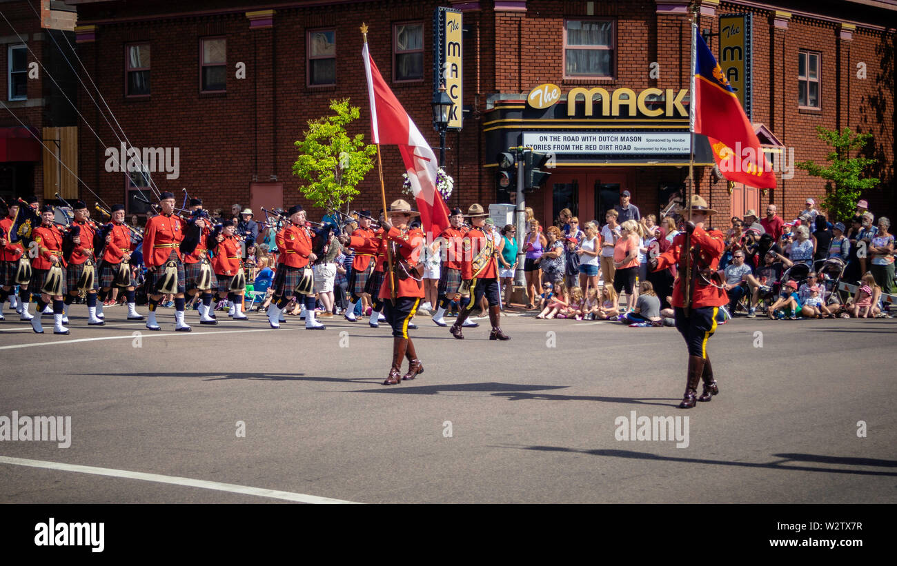 Royal Canadian Mounted Police (RCMP) officers marching in Gold Cup Parade to celebrate the PEI's Old Home Week in Charlottetown, Prince Edward Island Stock Photo