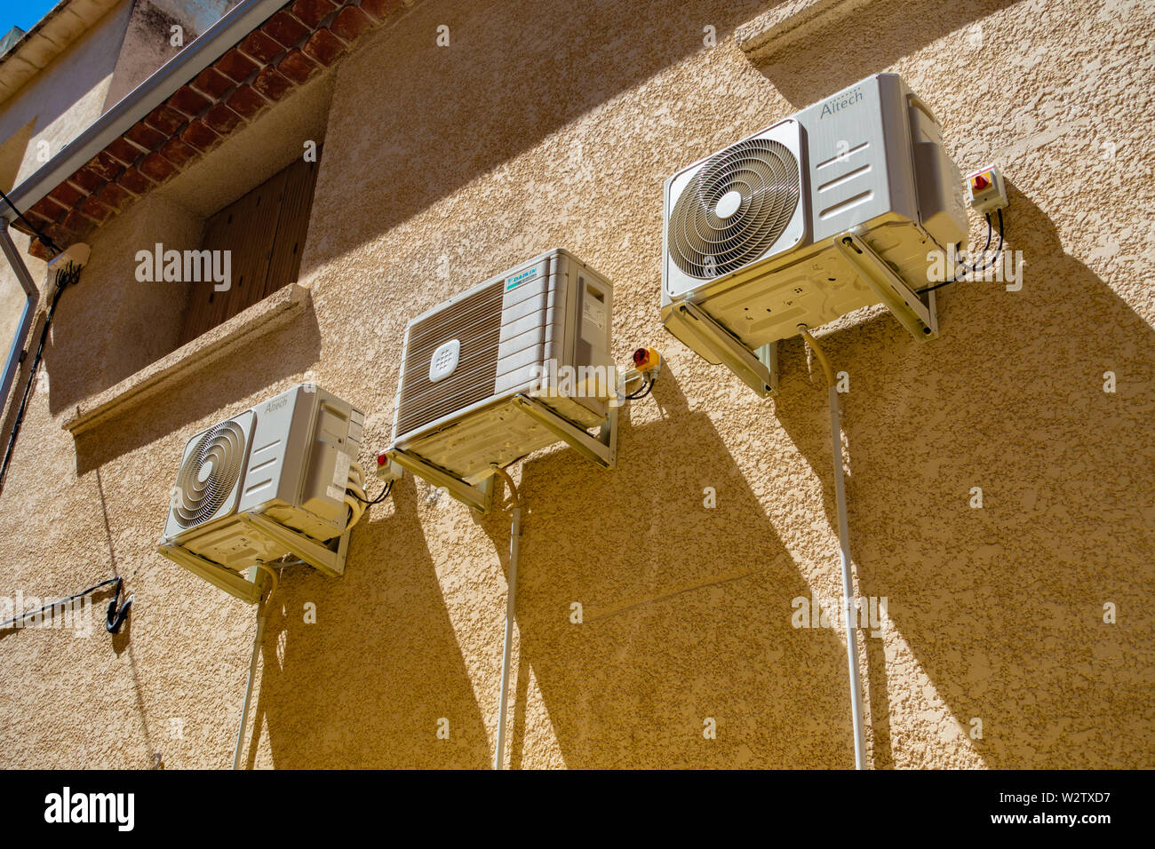 3 air conditioning units on a french house wall Stock Photo Alamy