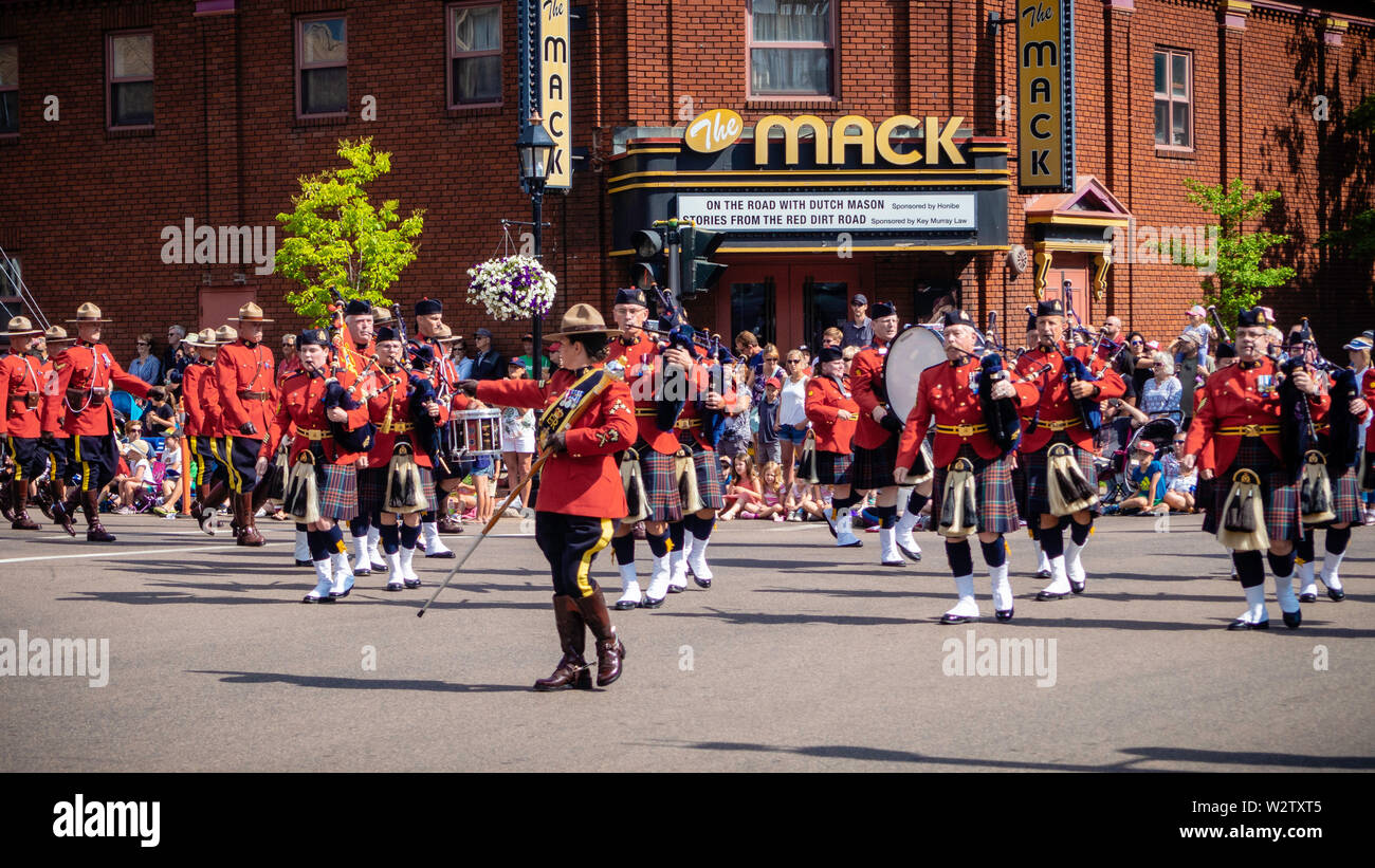 Royal Canadian Mounted Police (RCMP) Band marching band in Gold Cup Parade to celebrate the PEI's Old Home Week in Charlottetown, Prince Edward Island Stock Photo