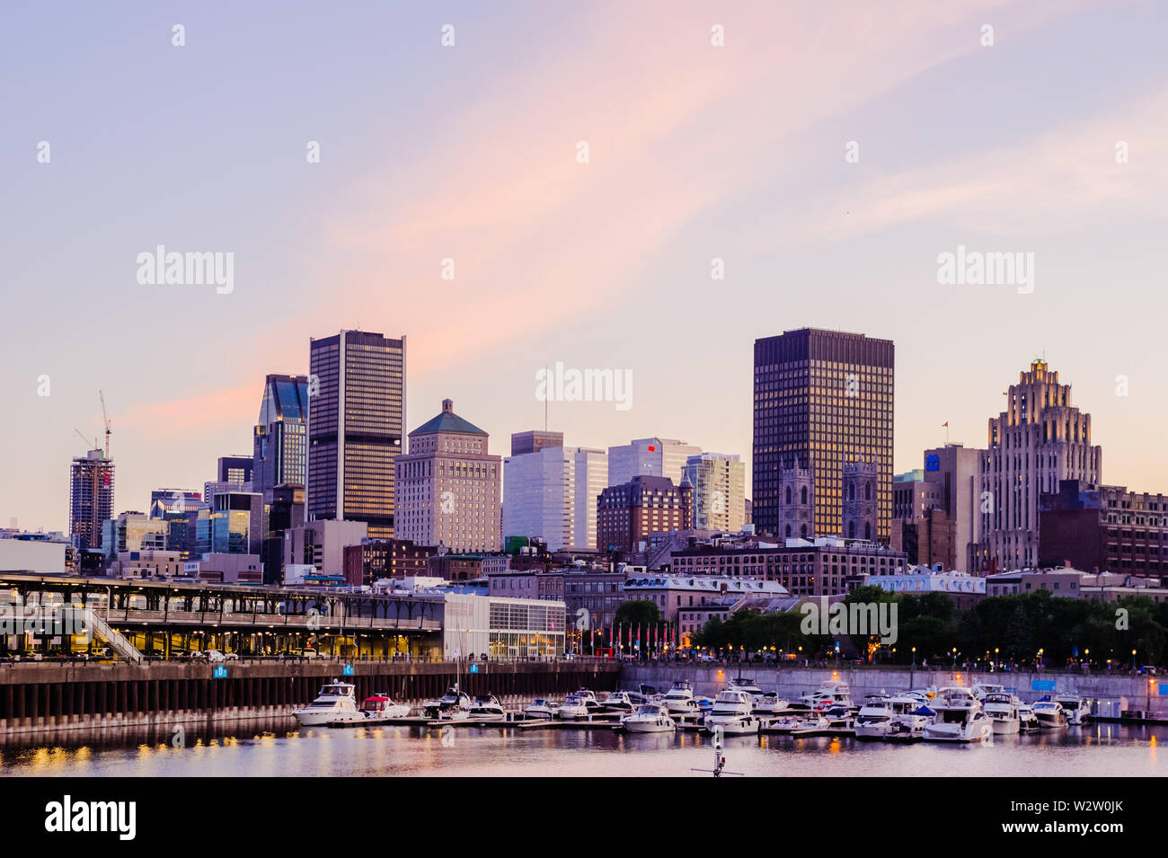 MONTREAL, CANADA - JUNE 15, 2018: The quays and historical old city near the waterfront are a popular tourist area on a summer evening. Stock Photo