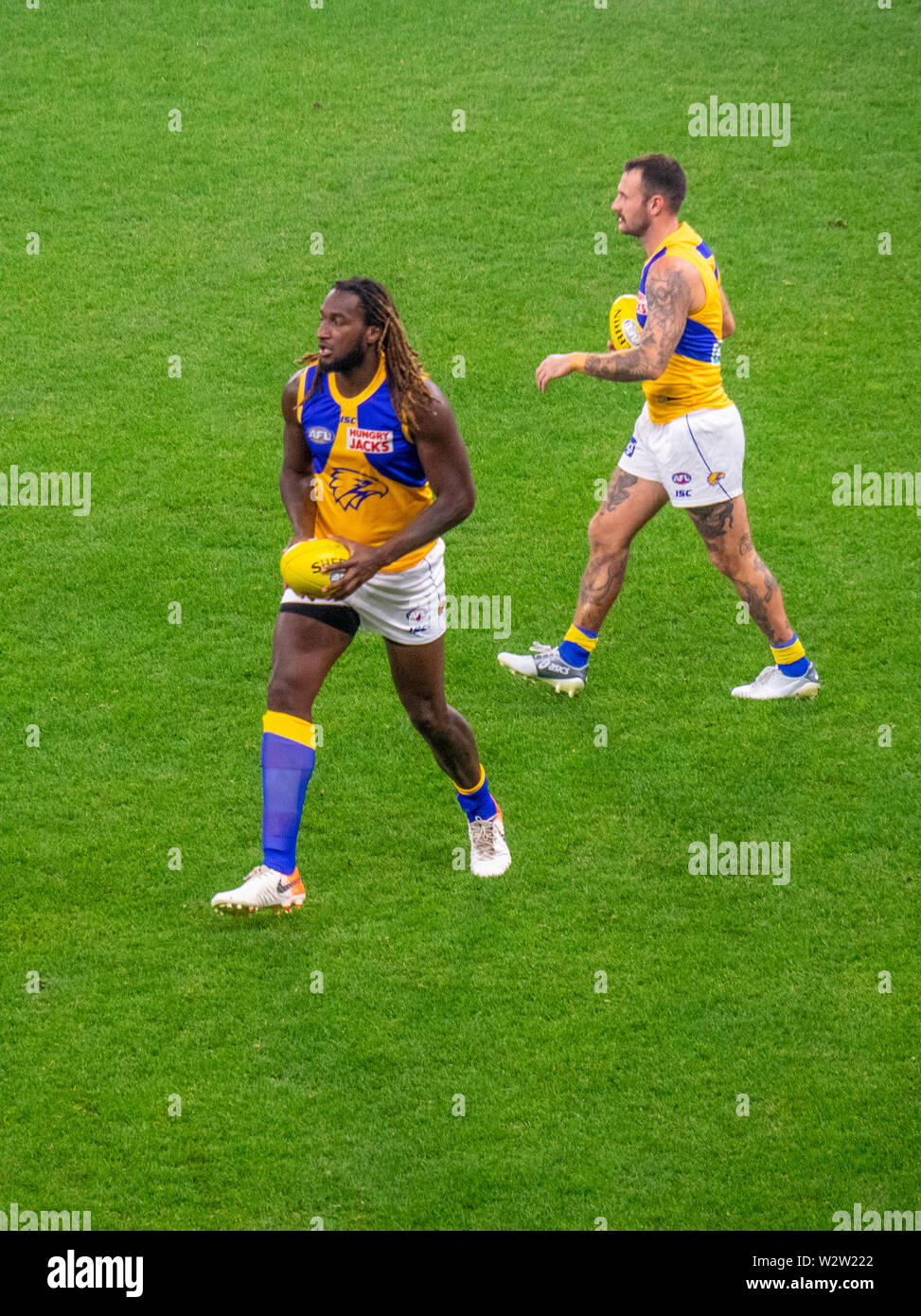 West Coast Eagles footballers Nic Naitanui And Chris Masten warming up before the Western Derby at Optus Stadium Perth Western Australia. Stock Photo