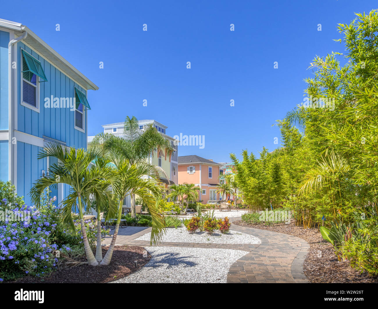 Margaritaville Resort Orlando. Stone walkway behind colorful island  caribbean charming cottages next to hotel Stock Photo - Alamy