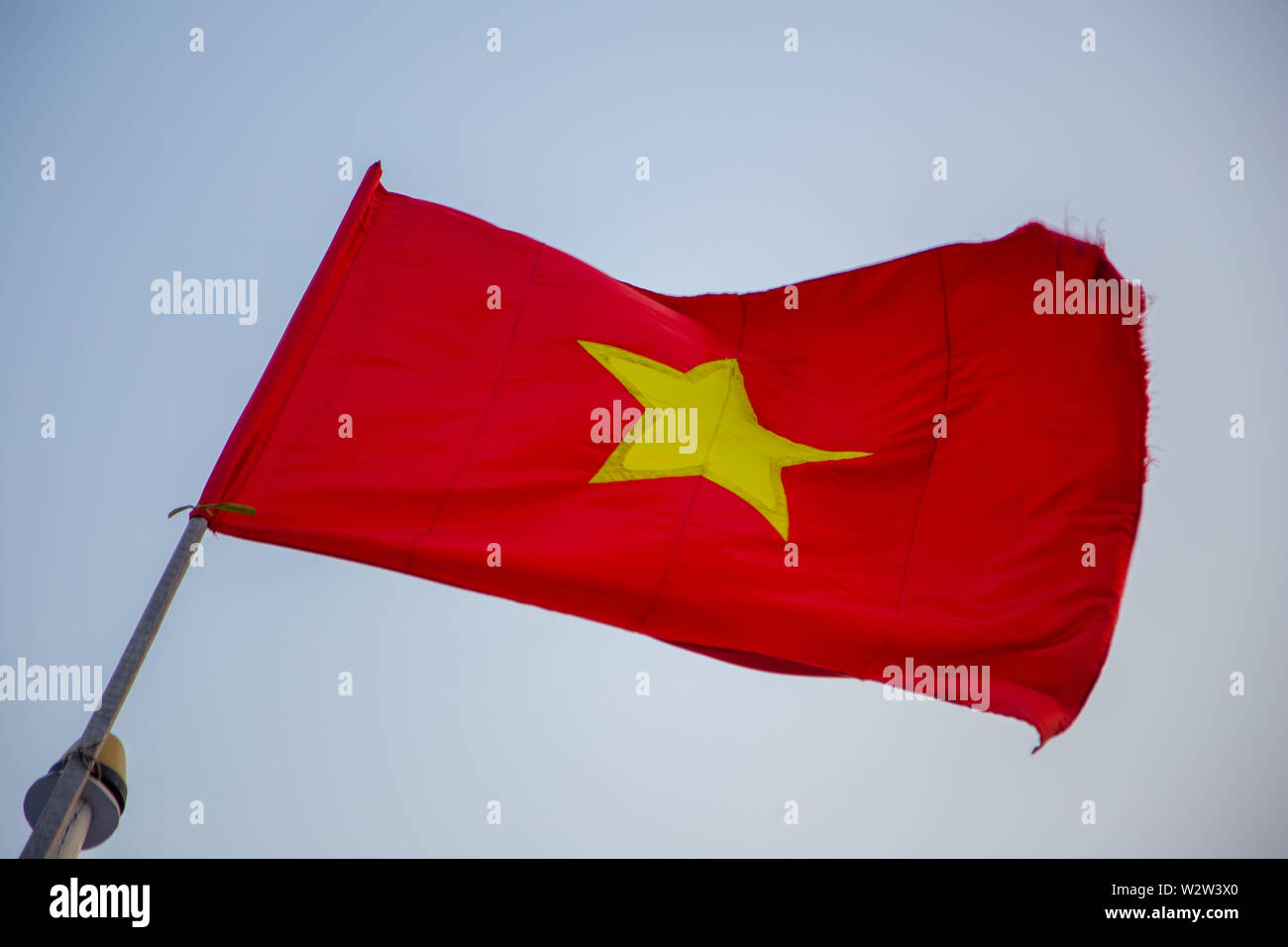 Waiving vietnamese national flag with the sky as background Stock Photo