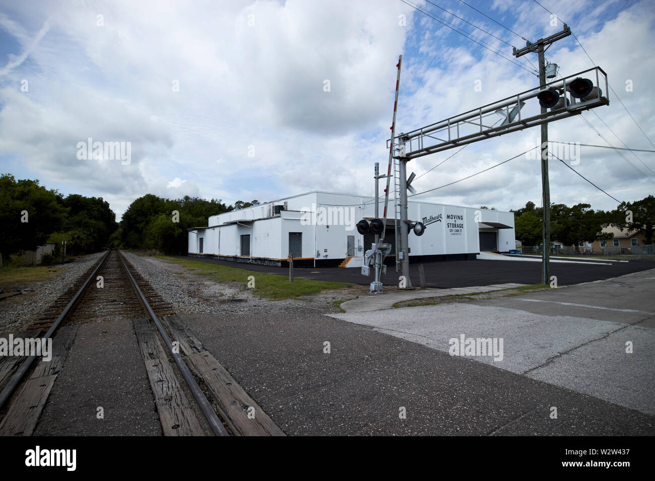 road signal lights and train tracks and railroad level crossing in northern Florida USA United States of America Stock Photo