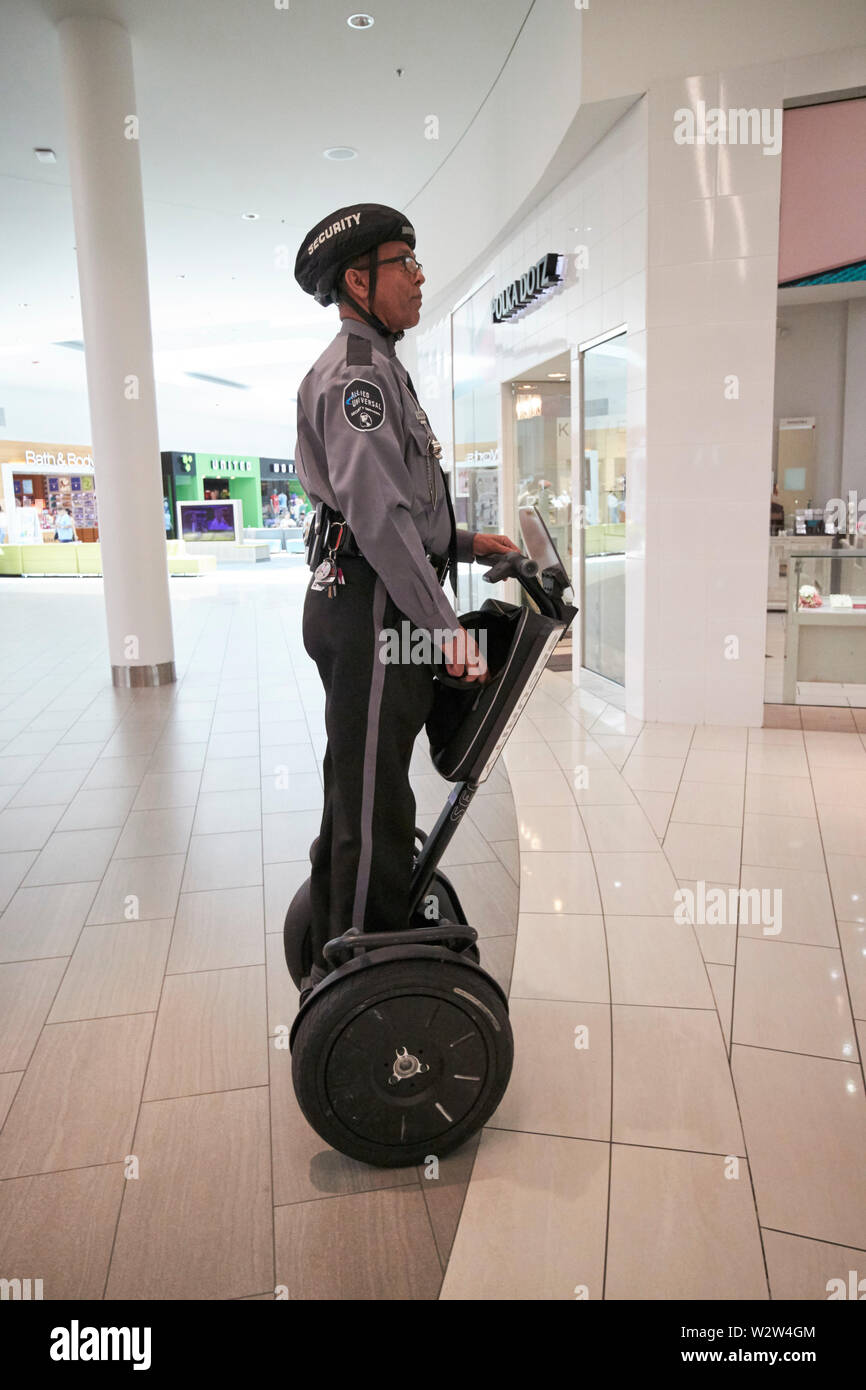 mall security guard on a segway at The Florida Mall enclosed shopping mall orlando Florida USA United States of America Stock Photo