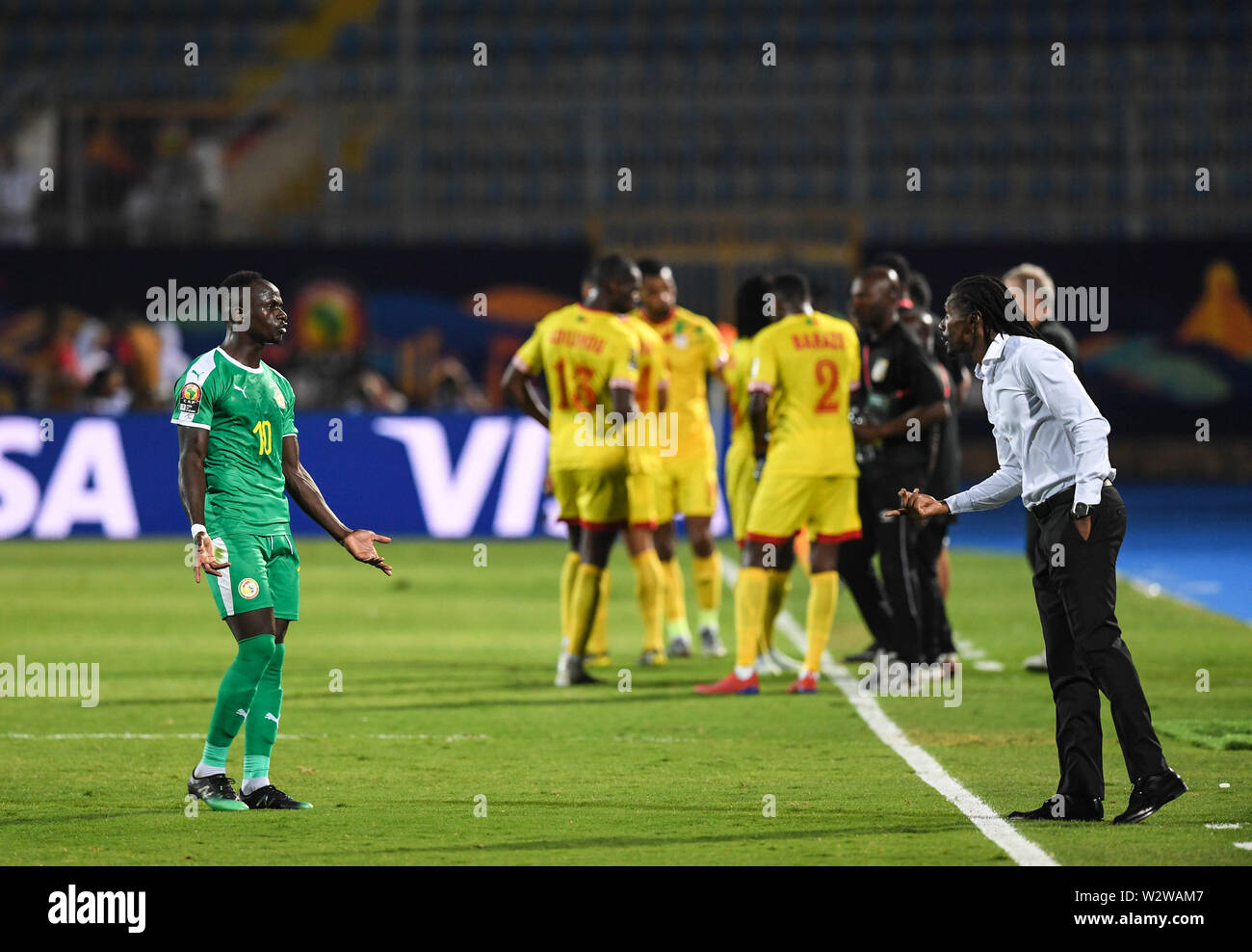 Cairo, Egypt. 10th July, 2019. Sadio Mane of Senegal (L) communicates with his coach Aliou Cisse during the quarterfinal between Senegal and Benin at the 2019 African Cup of Nations in Cairo, Egypt, July 10, 2019. Credit: Li Yan/Xinhua/Alamy Live News Stock Photo