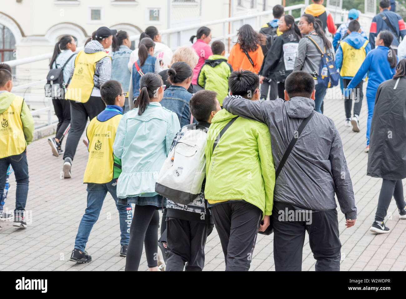 Russia, Vladivostok, 07/06/2019. Group of kids tourists from South Korea walking in city downtown. Tourism in Vladivostok, asian schoolchilds and kids Stock Photo