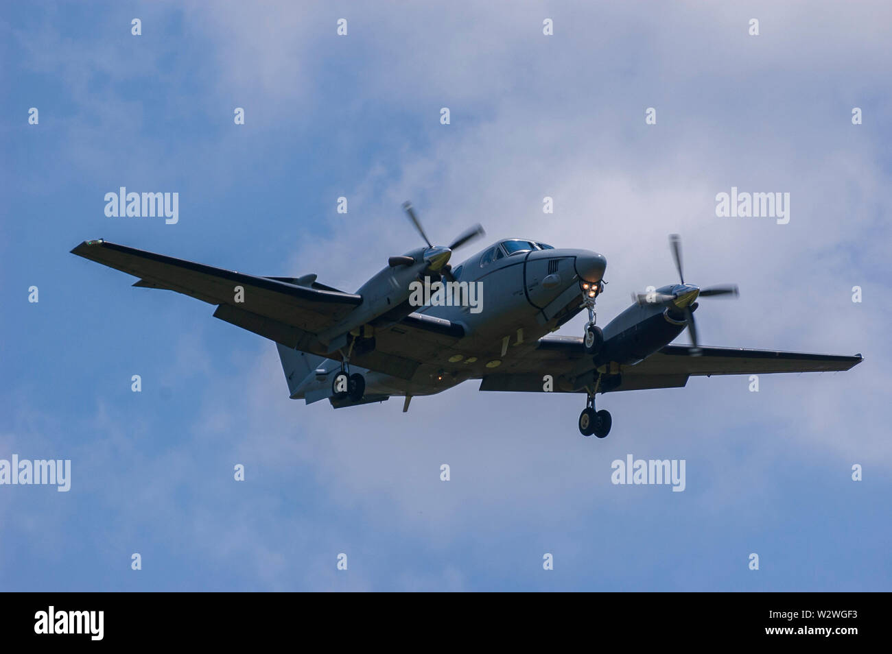 Prop plane landing at Lexington Bluegrass Field in Lexington Kentucky