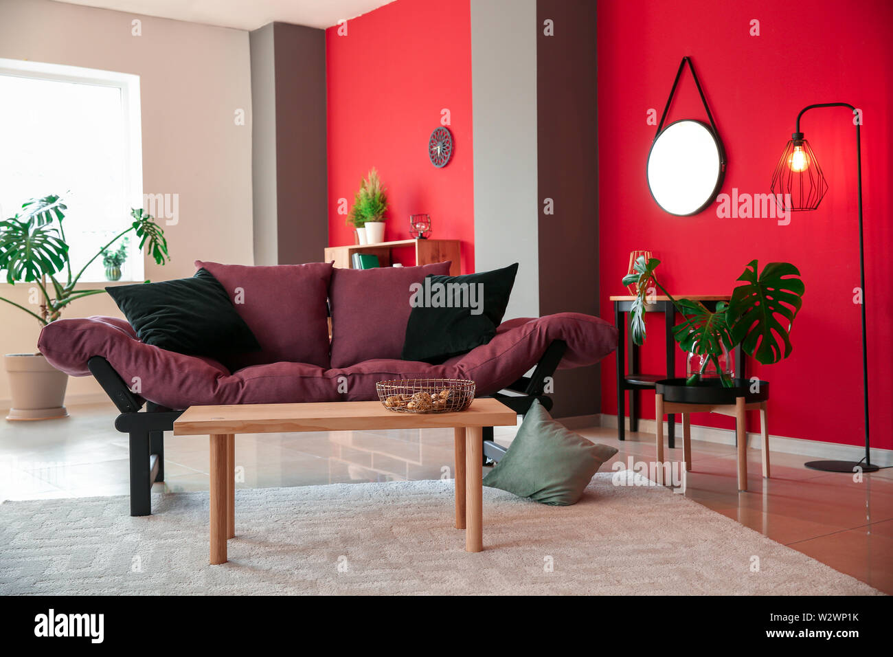 Interior of modern room with comfortable sofa Stock Photo - Alamy